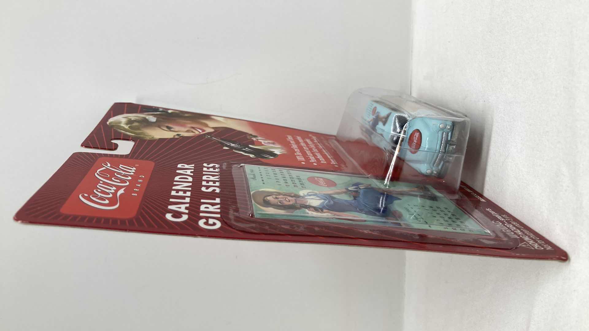 Photo 1 of JOHNNY LIGHTNING COCA-COLA CALENDAR GIRL SERIES ‘50 MERCURY WOODY WAGON