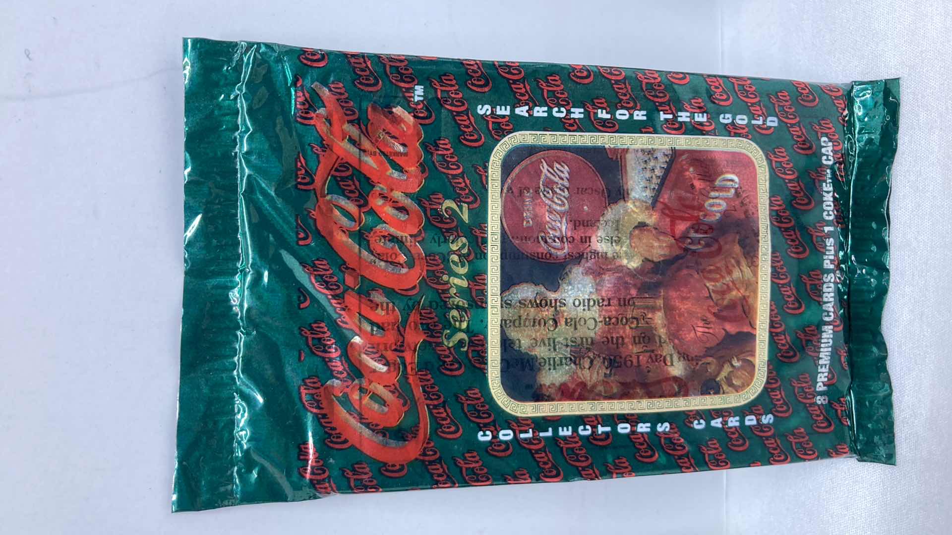 Photo 1 of COCA-COLA SERIES 2 SEARCH FOR GOLD PREMIUM COLLECTOR CARDS (4) SEALED