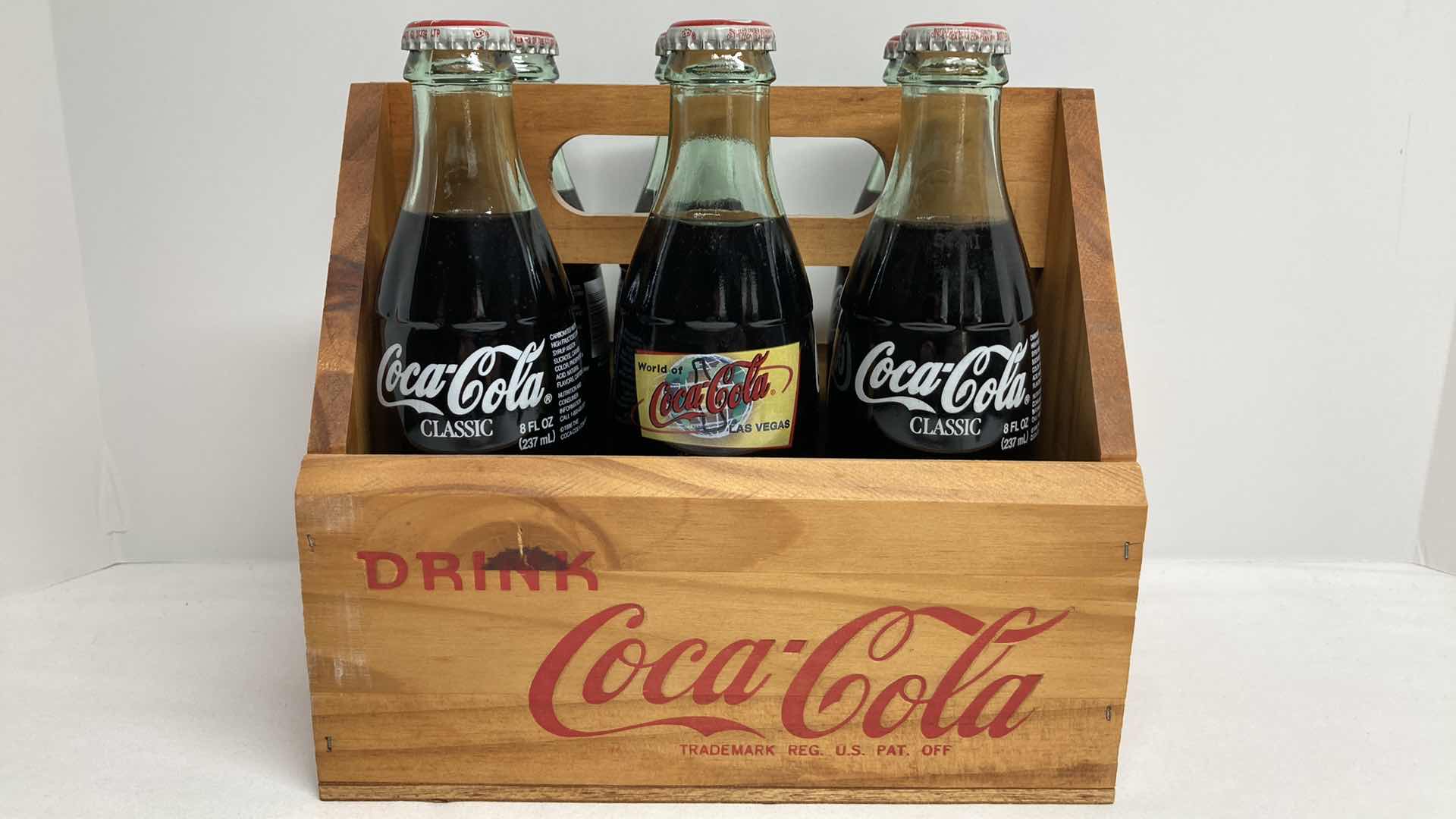 Photo 4 of COCA-COLA WORLD COCA-COLA LAS VEGAS GLASS SEALED BOTTLES (6) W WOOD CARRIER