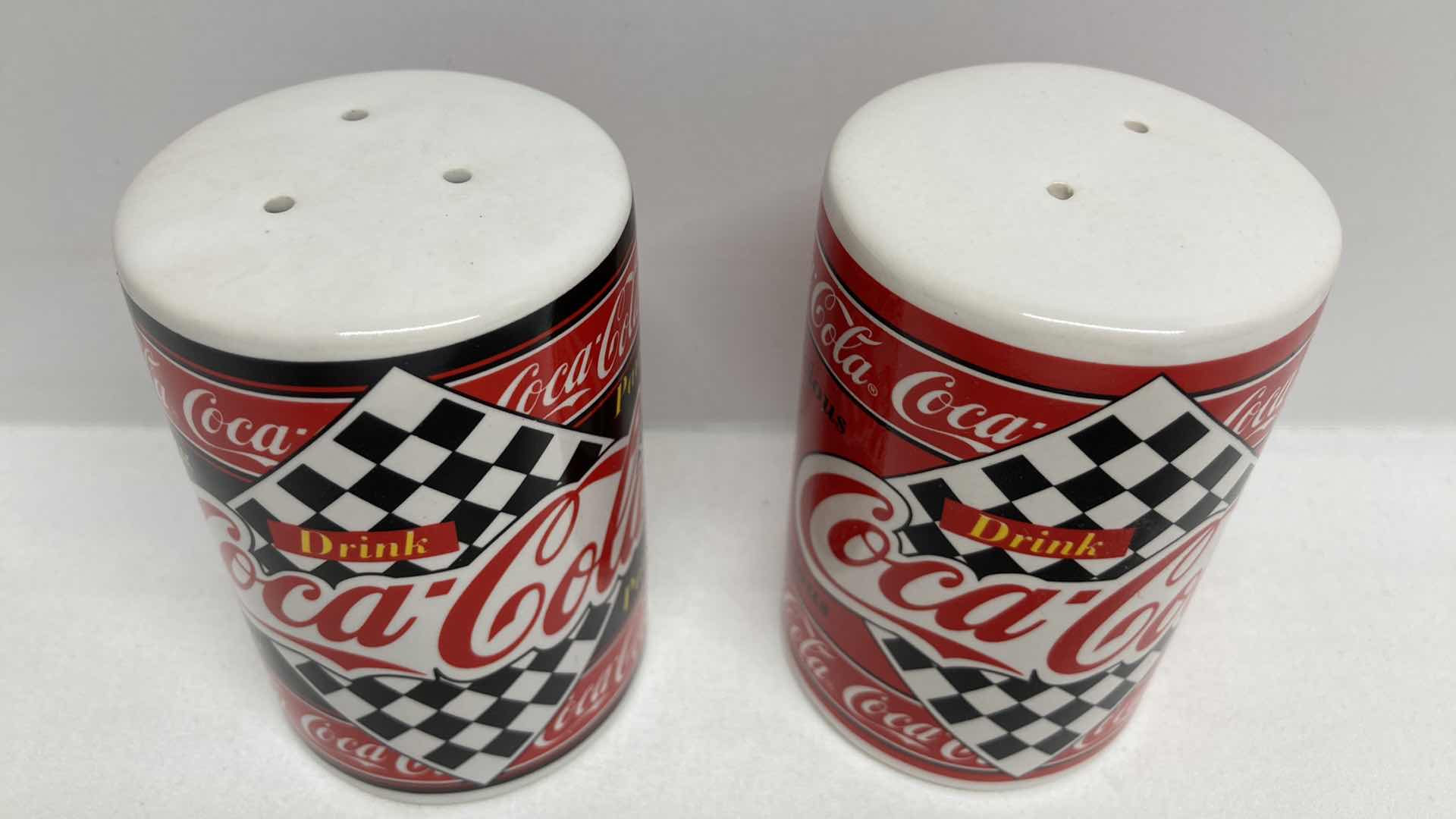 Photo 1 of COCA-COLA SALT & PEPPER SHAKERS 2.25” X 3.25”
