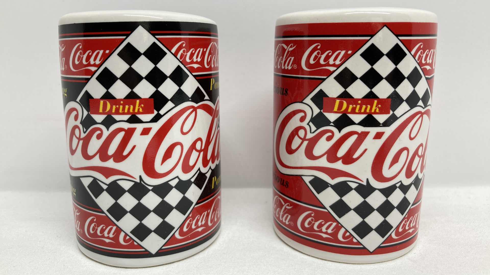 Photo 1 of COCA-COLA SALT & PEPPER SHAKERS 2.25” X 3.25”