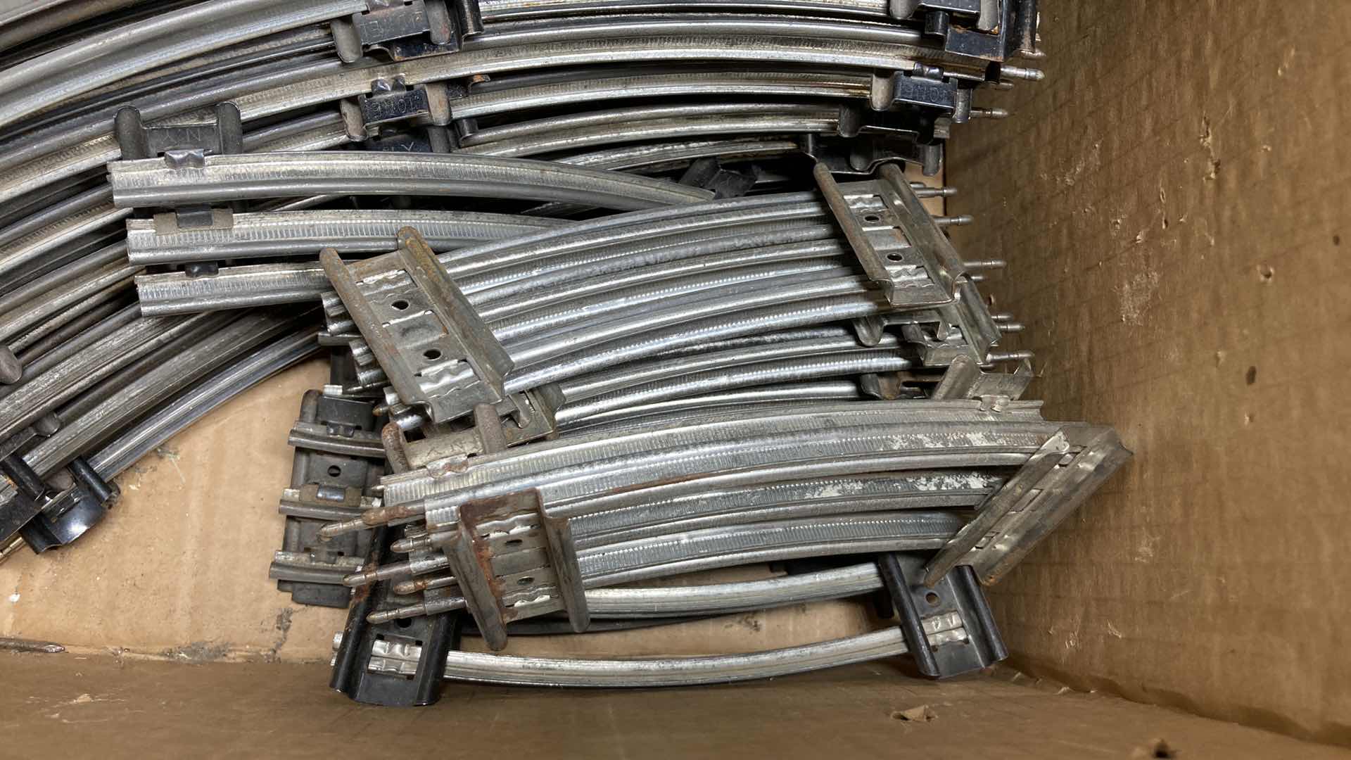 Photo 1 of LIONEL 6” & 12” O GAUGE CURVE TRACKS (APPROX 100)