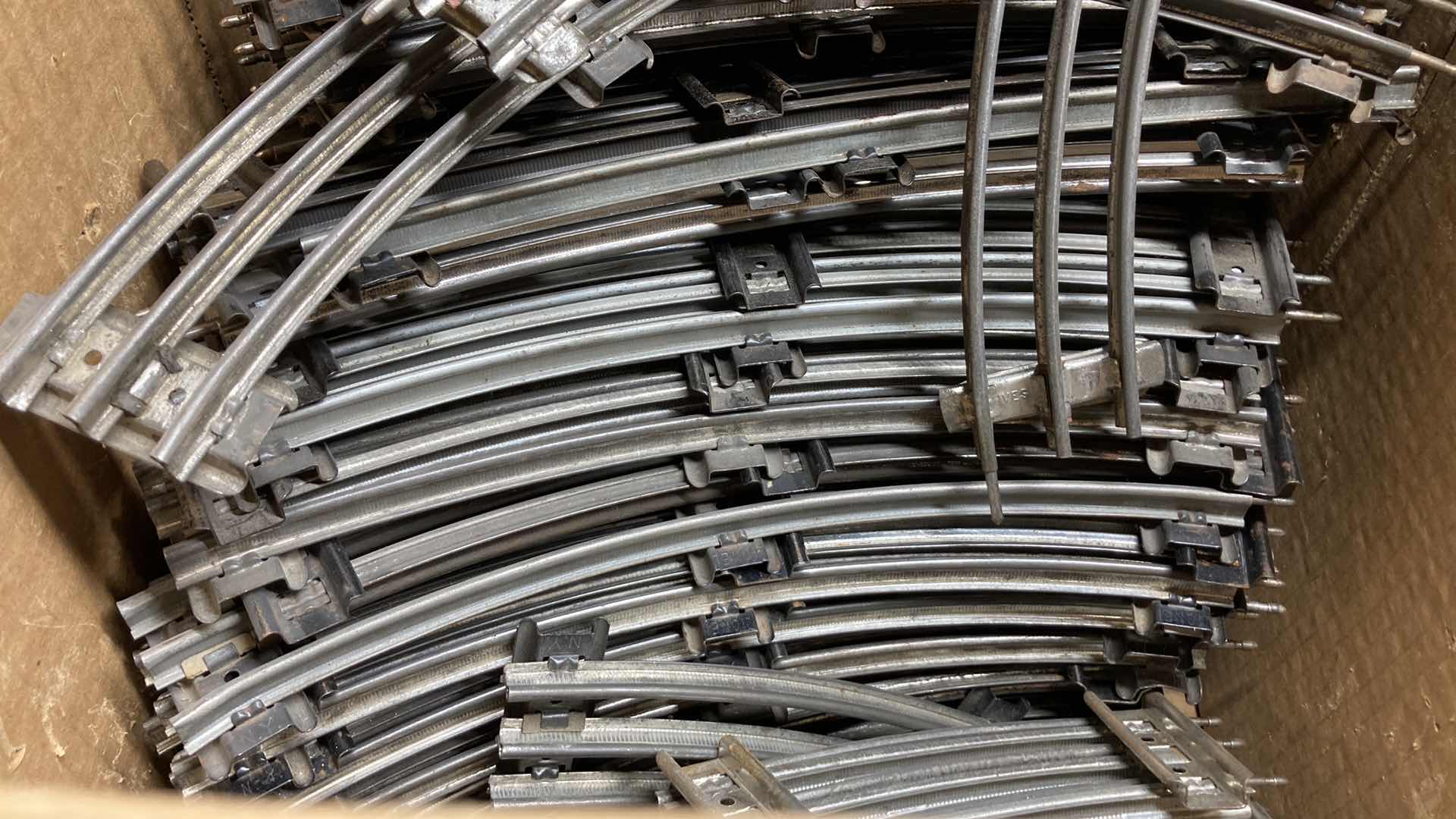 Photo 1 of LIONEL 6” & 12” O GAUGE CURVE TRACKS (APPROX 100)