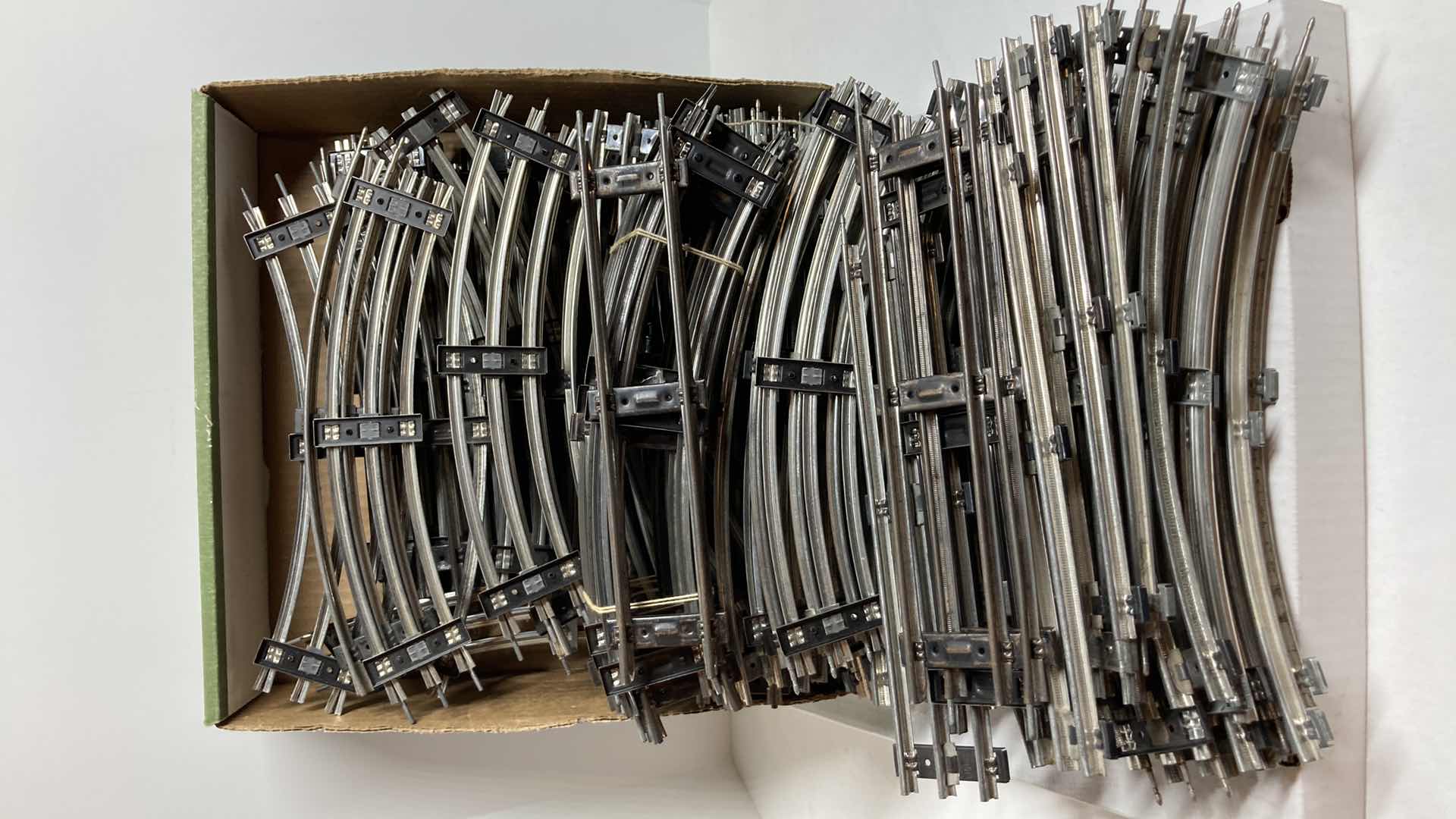 Photo 1 of LIONEL O27 GAUGE 90 CROSSOVER TRACKS 1021 (2) W 12” STRAIGHT & CURVE TRACKS (APPROX 60)