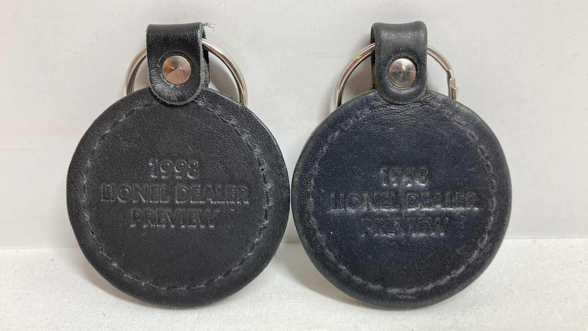 Photo 1 of LIONEL LEATHER KEYCHAIN (2) & LEATHER LUGGAGE TAGS (2)