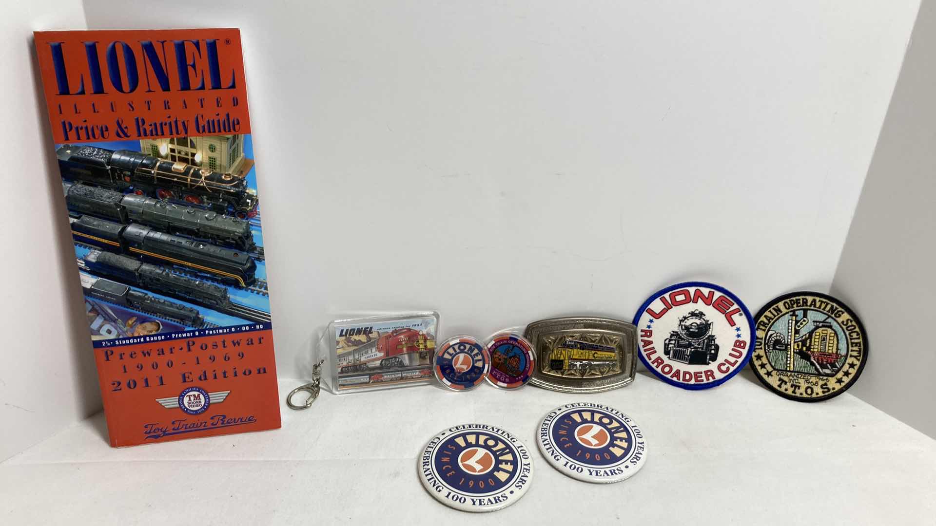 Photo 1 of LIONEL PRICE & RARITY GUIDE W TRAIN MEMORABILIA (8)