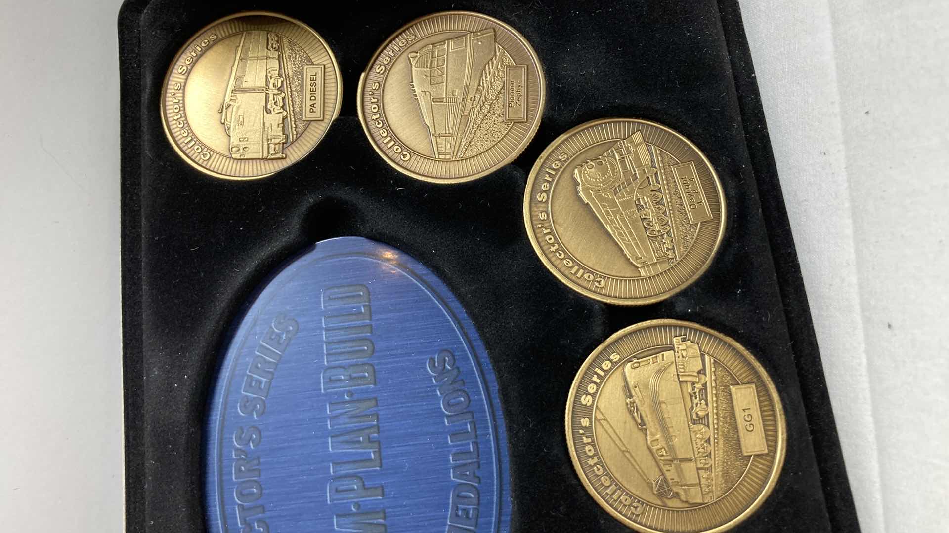 Photo 1 of COLLECTORS SERIES MEDALLIONS (9) W NATIONS TREASURES MANITOU & PIKES PEAK RY ORNAMENT