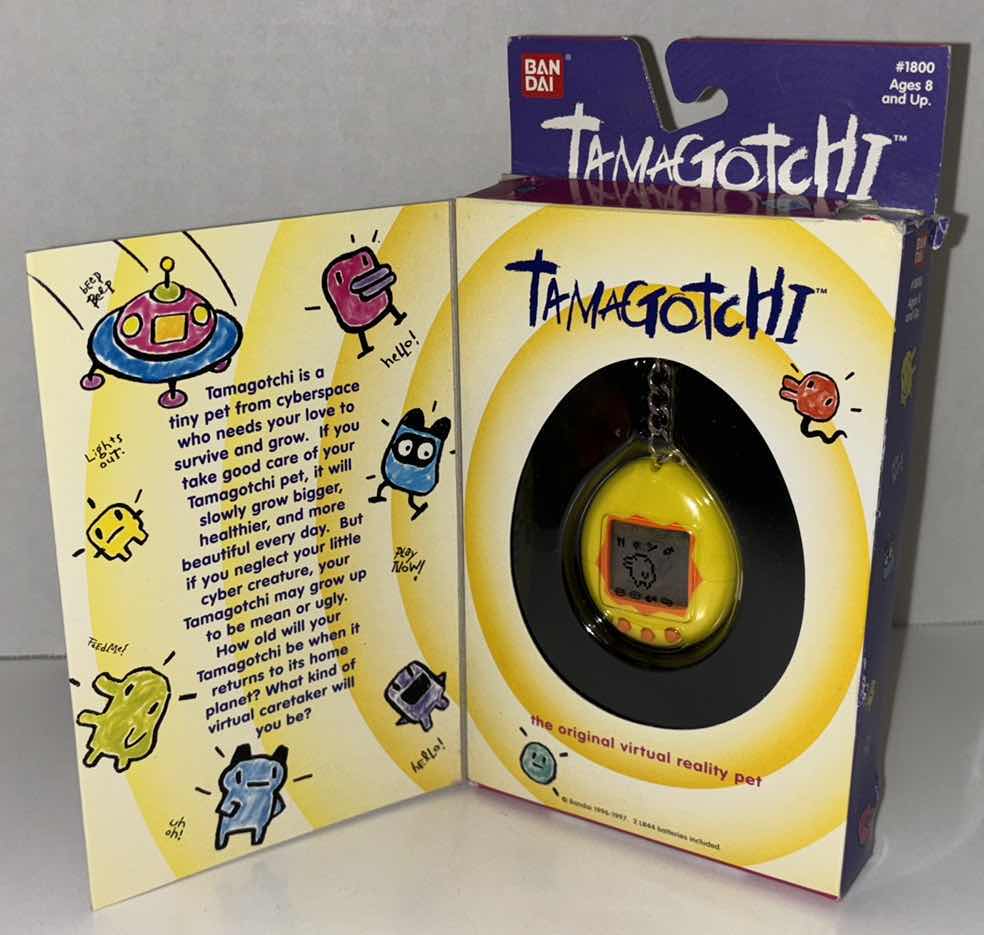 Photo 1 of NEW BANDAI 1996-97 TAMAGOTCHI, THE ORIGINAL VIRTUAL REALITY PET (YELLOW/ORANGE) **NO RETURNS**