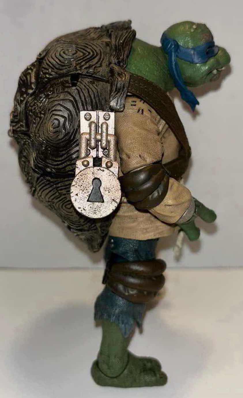Photo 2 of NECA UNIVERSAL MONSTERS VS TMNT 7” ULTIMATE ACTION FIGURE “LEONARDO AS HUNCHBACK” **NO RETURNS**
