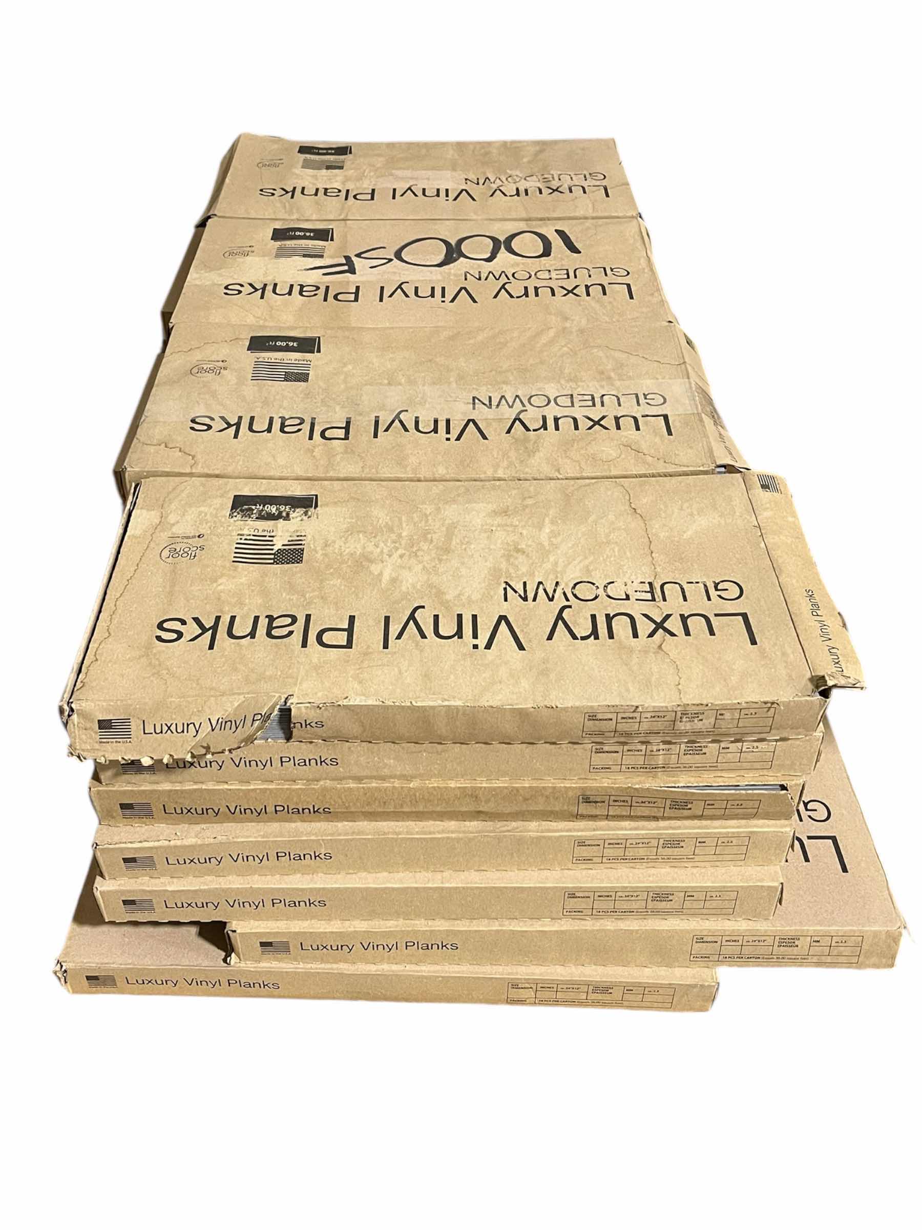 Photo 1 of LVP GRAY WASH FINISH GLUE DOWN VINYL PLANKS 12” X 24” (36SQFT PER CASE/28CASES APPROX.1008SQFT TOTAL) READ NOTES