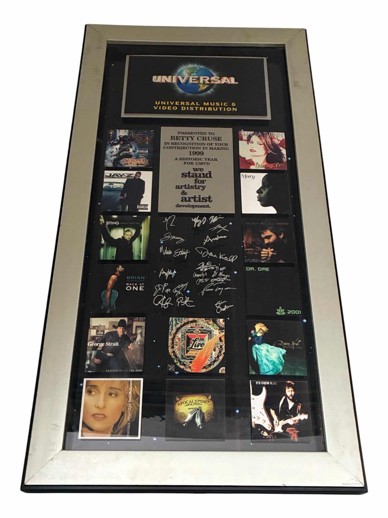 Photo 1 of UNIVERSAL STUDIOS MUSIC & VIDEO DISTRIBUTION PRESENTED TO BETTY CRUZ AND RECOGNITION OF YOUR CONTRIBUTION AND MAKING 1999 A HISTORICAL YEAR FOR UMVD WE STAND FOR ARTISTRY AND ARTIST DEVELOPMENT PLAQUE SIGNED BY MULTIPLE FAMOUS MUSICIANS 15“ X 29“
