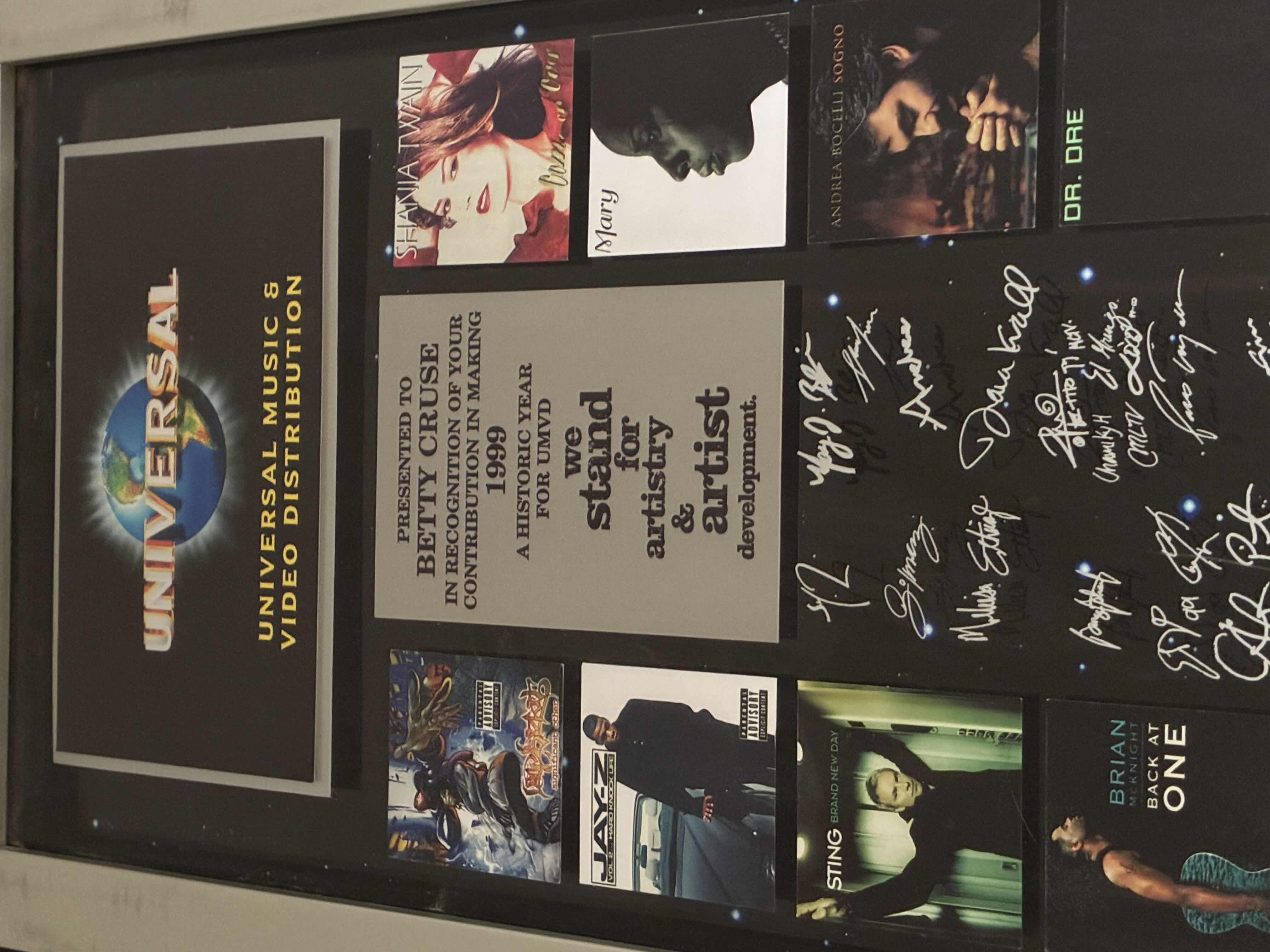 Photo 1 of UNIVERSAL STUDIOS MUSIC & VIDEO DISTRIBUTION PRESENTED TO BETTY CRUZ AND RECOGNITION OF YOUR CONTRIBUTION AND MAKING 1999 A HISTORICAL YEAR FOR UMVD WE STAND FOR ARTISTRY AND ARTIST DEVELOPMENT PLAQUE SIGNED BY MULTIPLE FAMOUS MUSICIANS 15“ X 29“