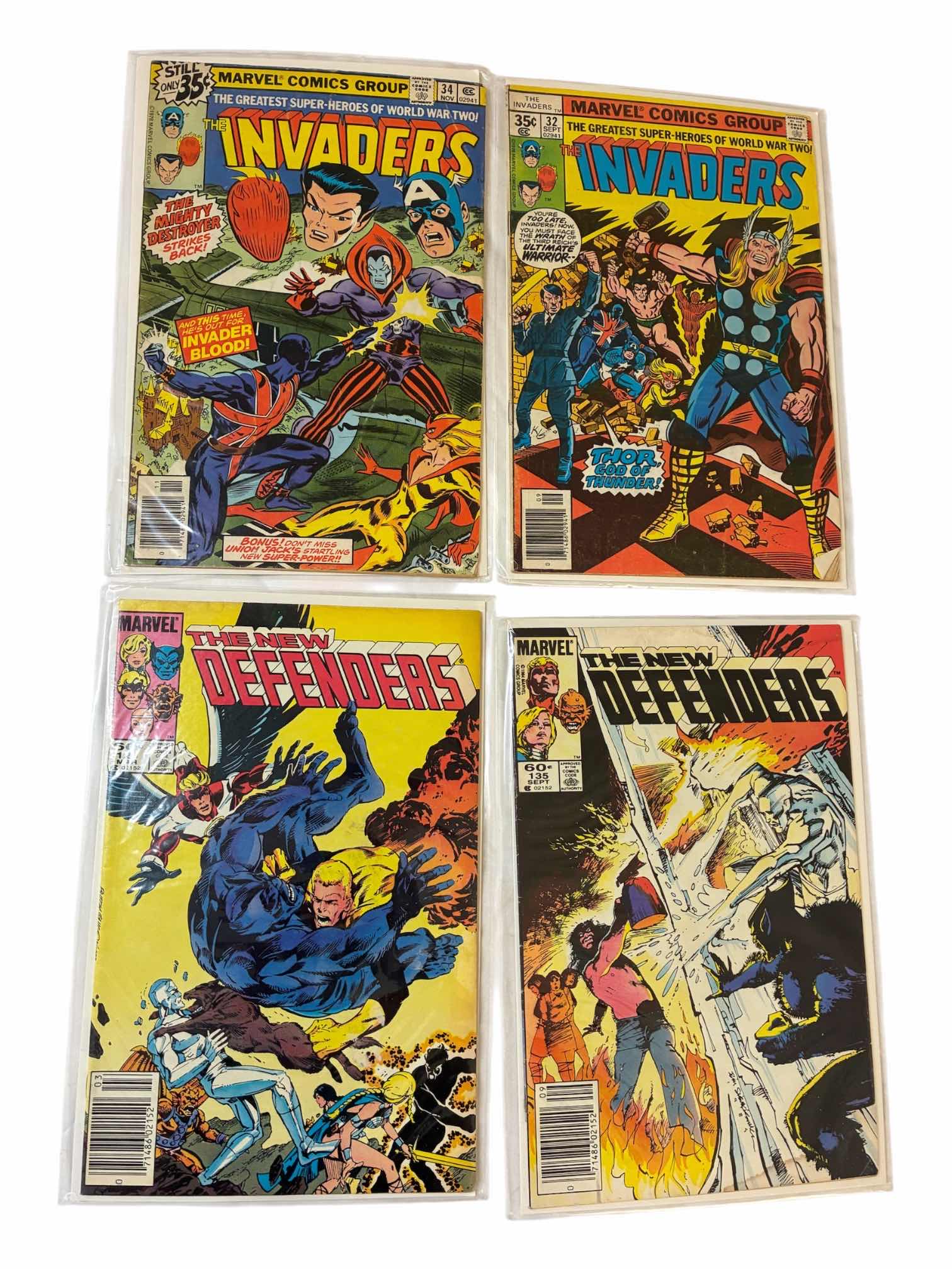Photo 1 of MARVEL THE INVADERS & THE DEFENDERS COMIC BOOKS (4)