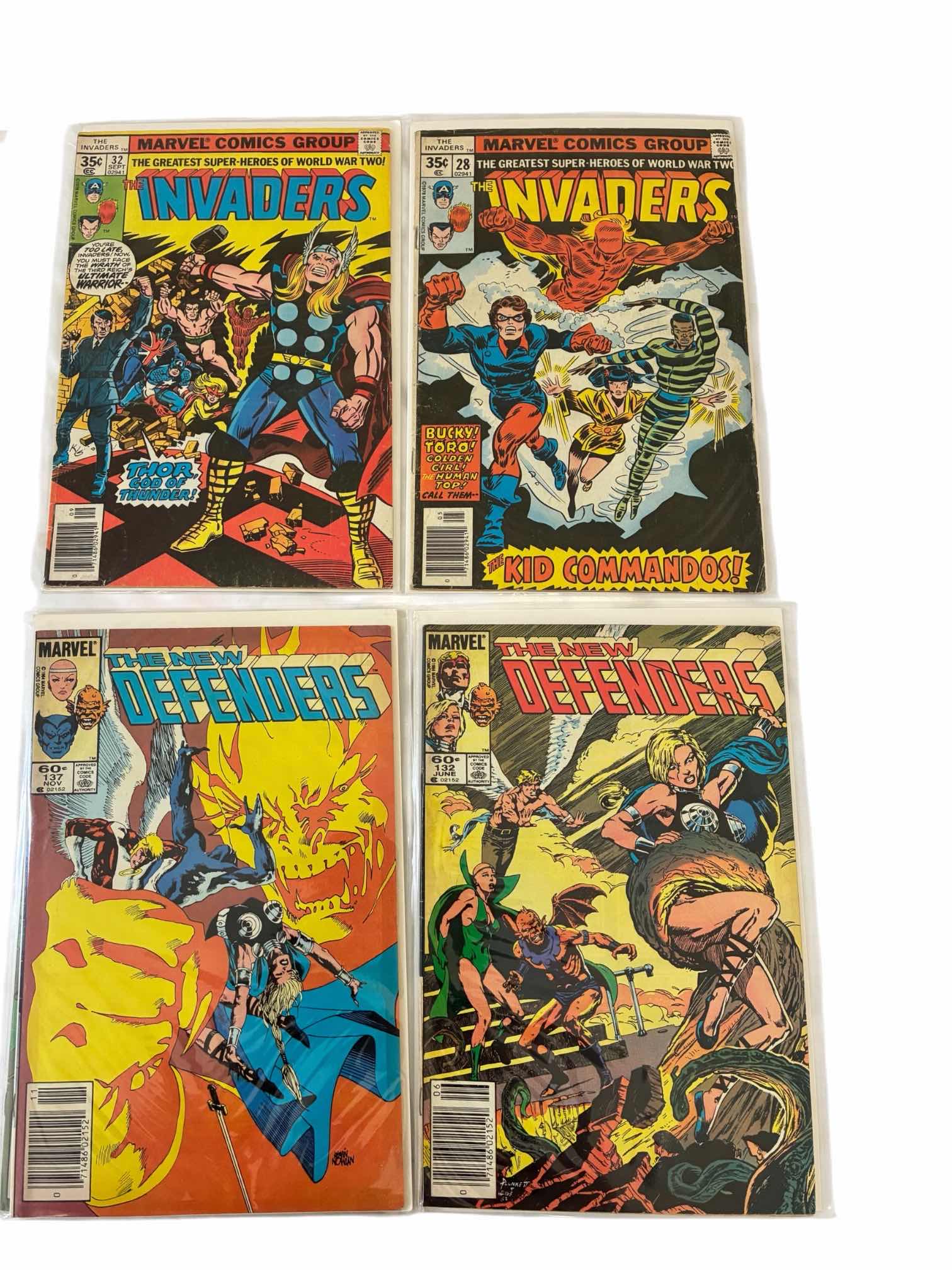 Photo 1 of MARVEL THE INVADERS & THE DEFENDERS COMIC BOOKS (4)