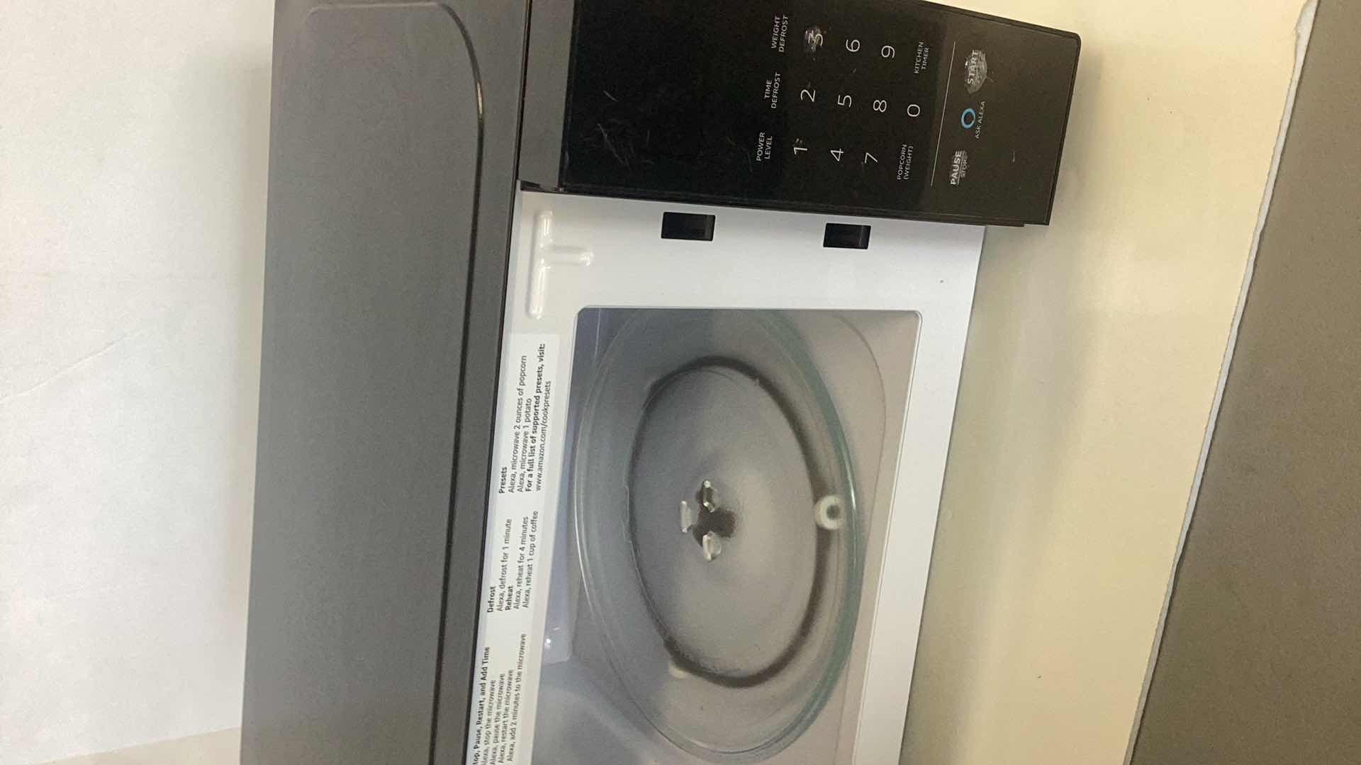 Photo 1 of AMAZON BASICS MICROWAVE WITH ALEXA 17” X 12” H 10”