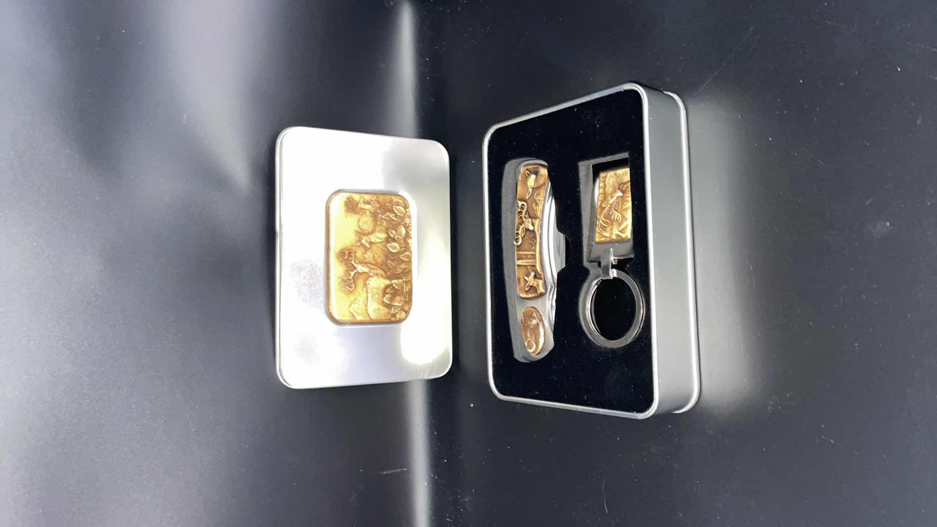 Photo 1 of DECORATIVE BUCK TIN WITH POCKET KNIFE AND KEYCHAIN