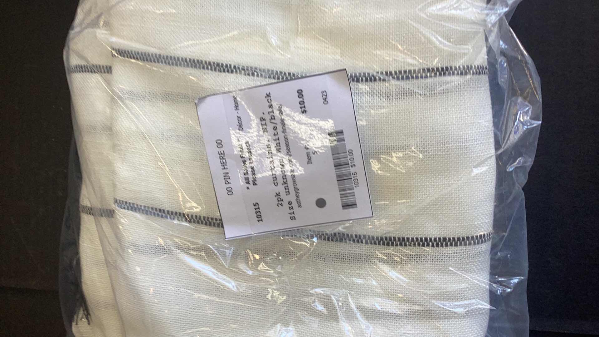 Photo 1 of TWO SETS OF CURTAINS ONE IS BLACK OUT