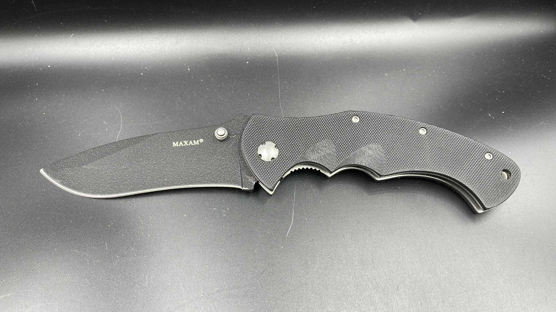 Photo 1 of MAXAM FOLDING BLACK HUNTING KNIFE 9”