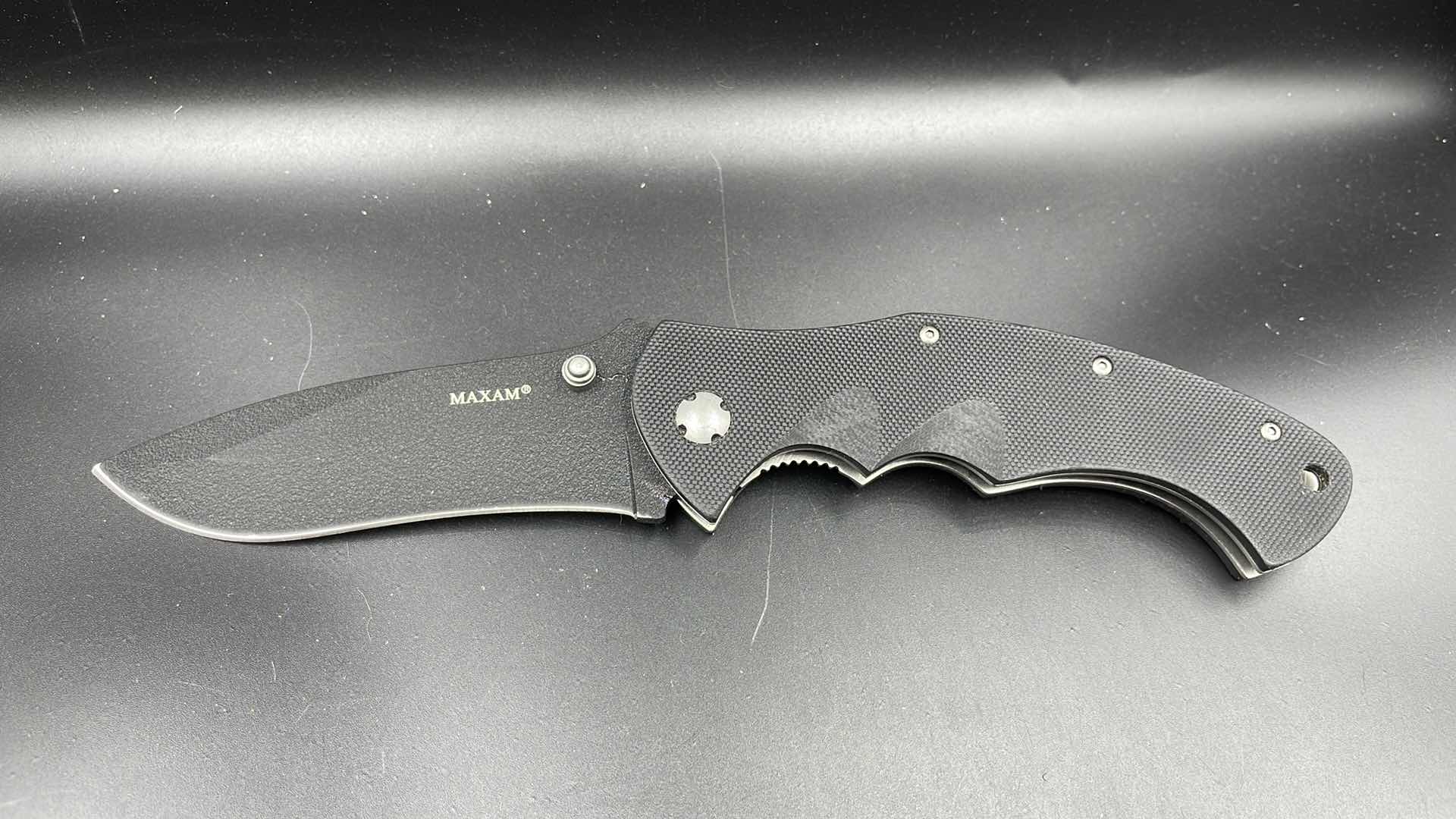 Photo 1 of MAXAM FOLDING BLACK HUNTING KNIFE 9”