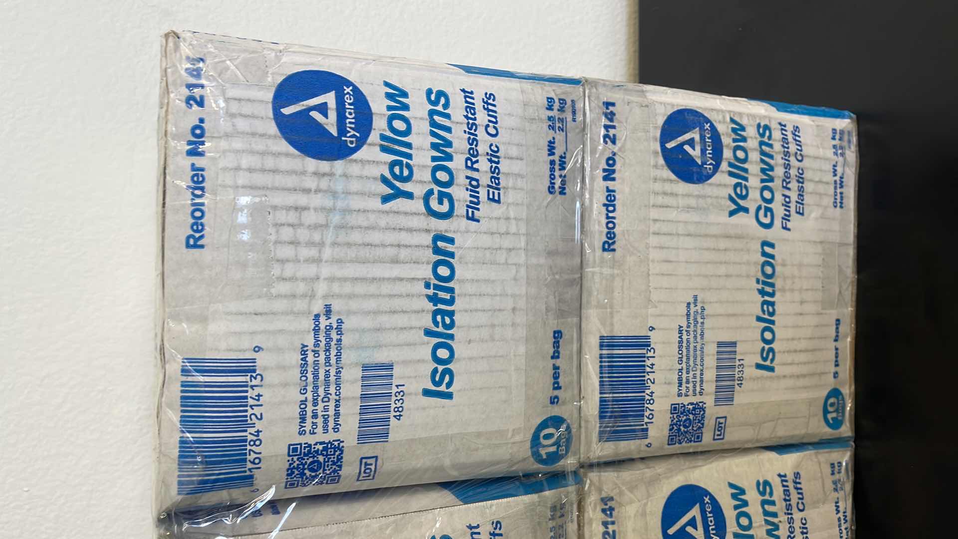 Photo 1 of 4 BOXES OF YELLOW FLUID RESISTANT ISOLATION GOWNS W ELASTIC CUFFS (50 PER BOX)