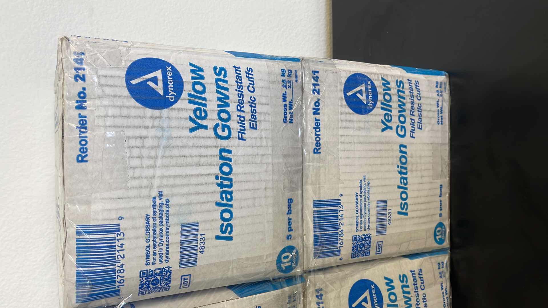 Photo 1 of 4 BOXES OF YELLOW FLUID RESISTANT ISOLATION GOWNS W ELASTIC CUFFS (50 PER BOX)