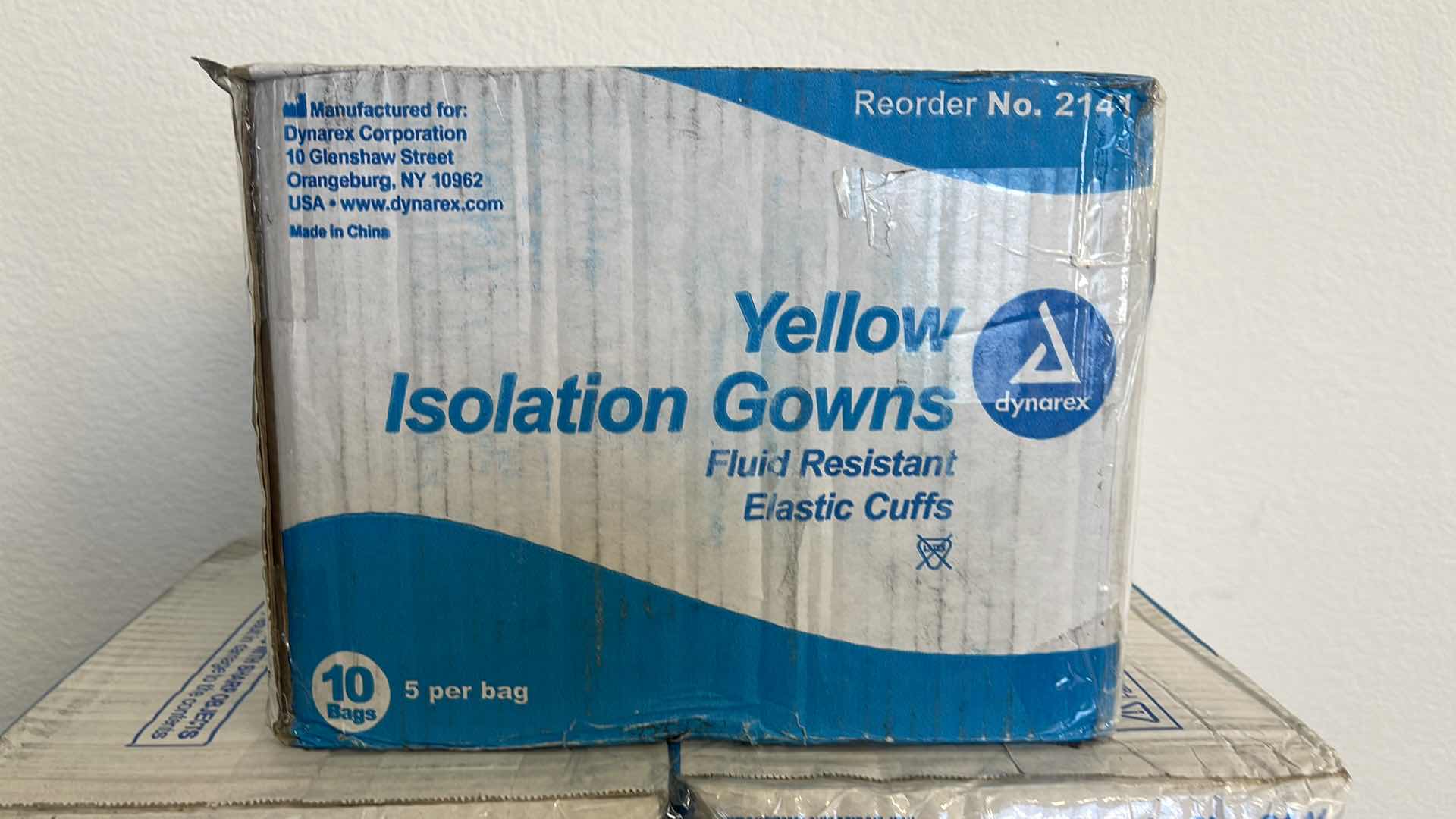 Photo 1 of 5 BOXES OF YELLOW FLUID RESISTANT ISOLATION GOWNS W ELASTIC CUFFS (50 PER BOX)
