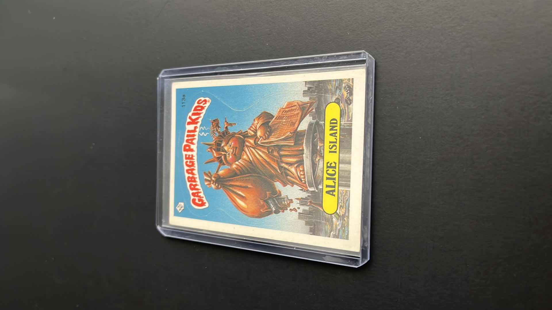 Photo 1 of 1986 GARBAGE PAIL KIDS ALICE ISLAND TOPPS CARD 113A