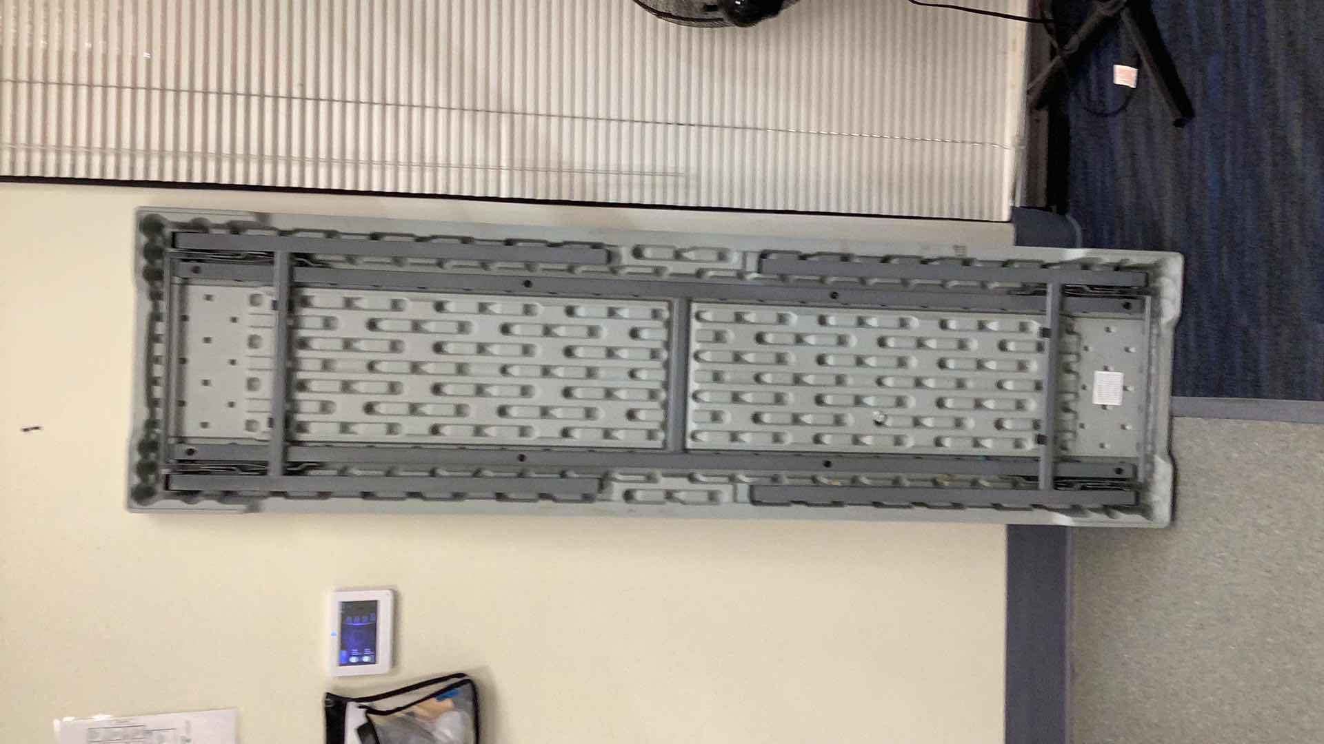 Photo 1 of MULTIPURPOSE FOLDING TABLE 71”X 20” H29” 