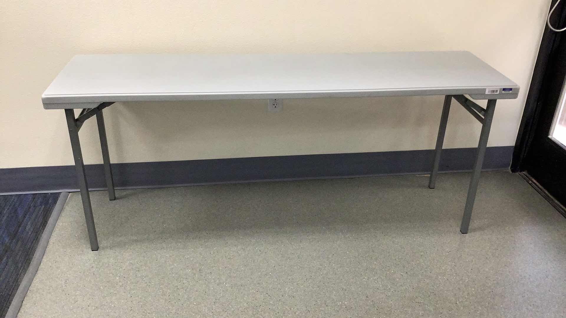 Photo 1 of MULTIPURPOSE FOLDING TABLE 71”X 20” H 29”