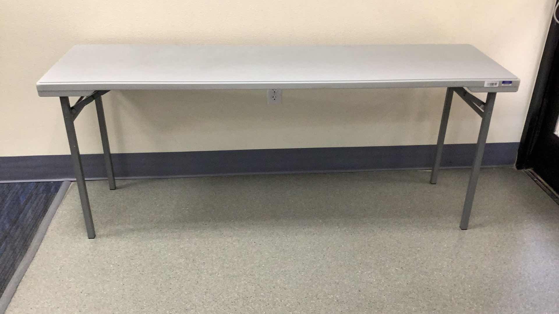 Photo 1 of MULTIPURPOSE FOLDING TABLE 71”X 20” H29” 