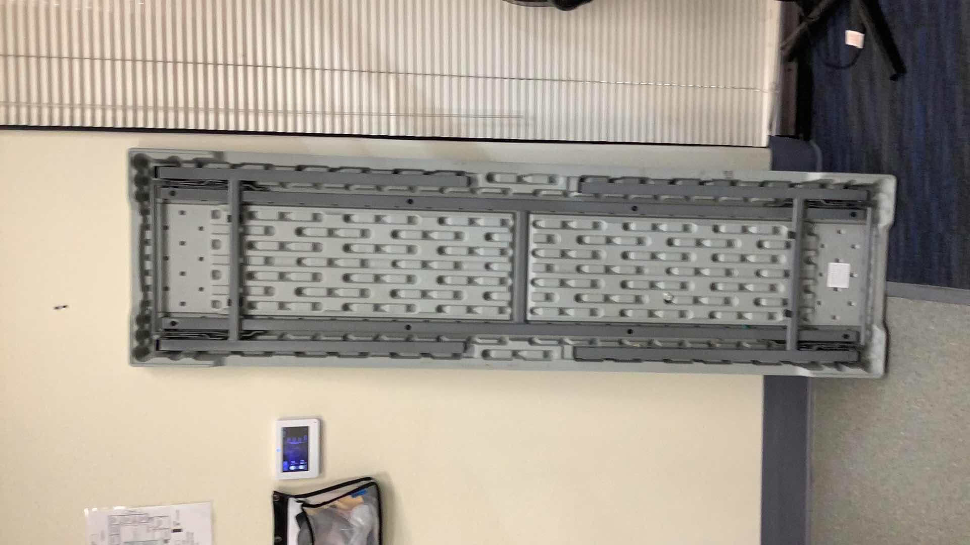 Photo 1 of MULTIPURPOSE FOLDING TABLE 71”X 20” H29” 