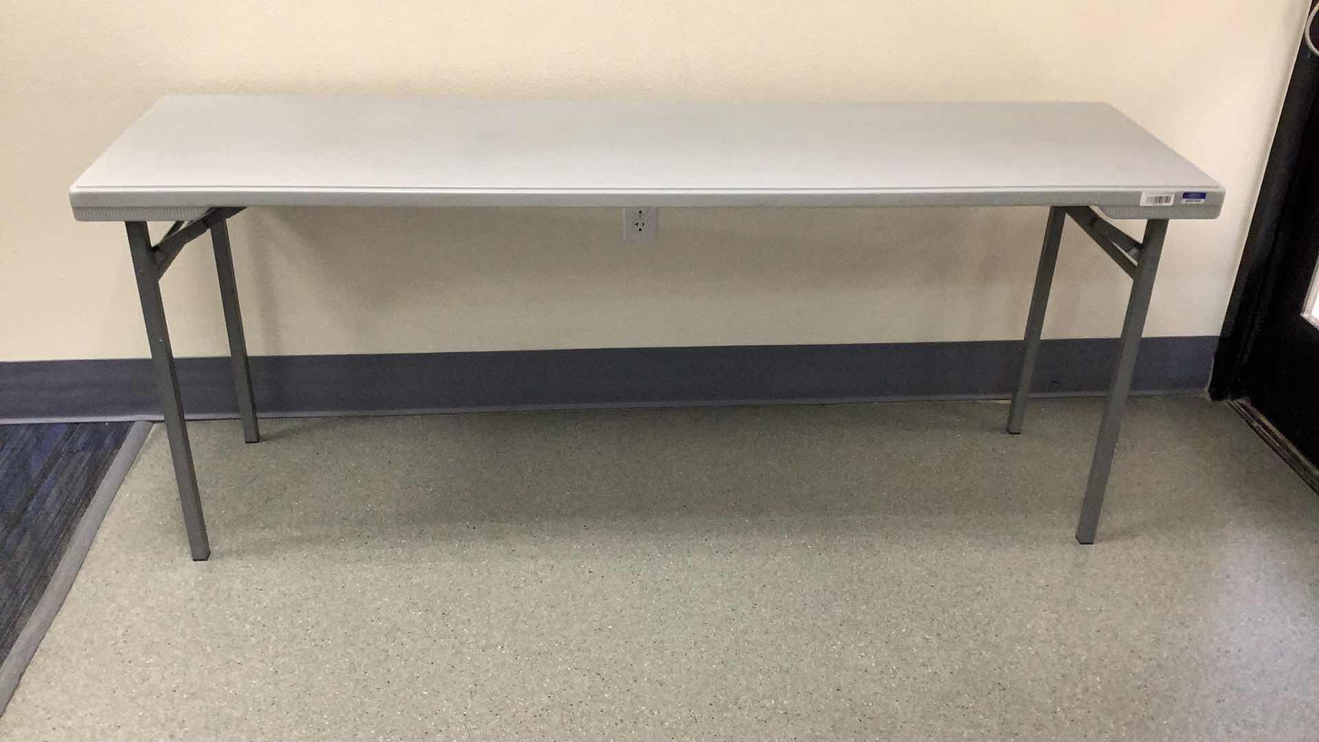 Photo 1 of MULTIPURPOSE FOLDING TABLE 71”X 20” H 29” 