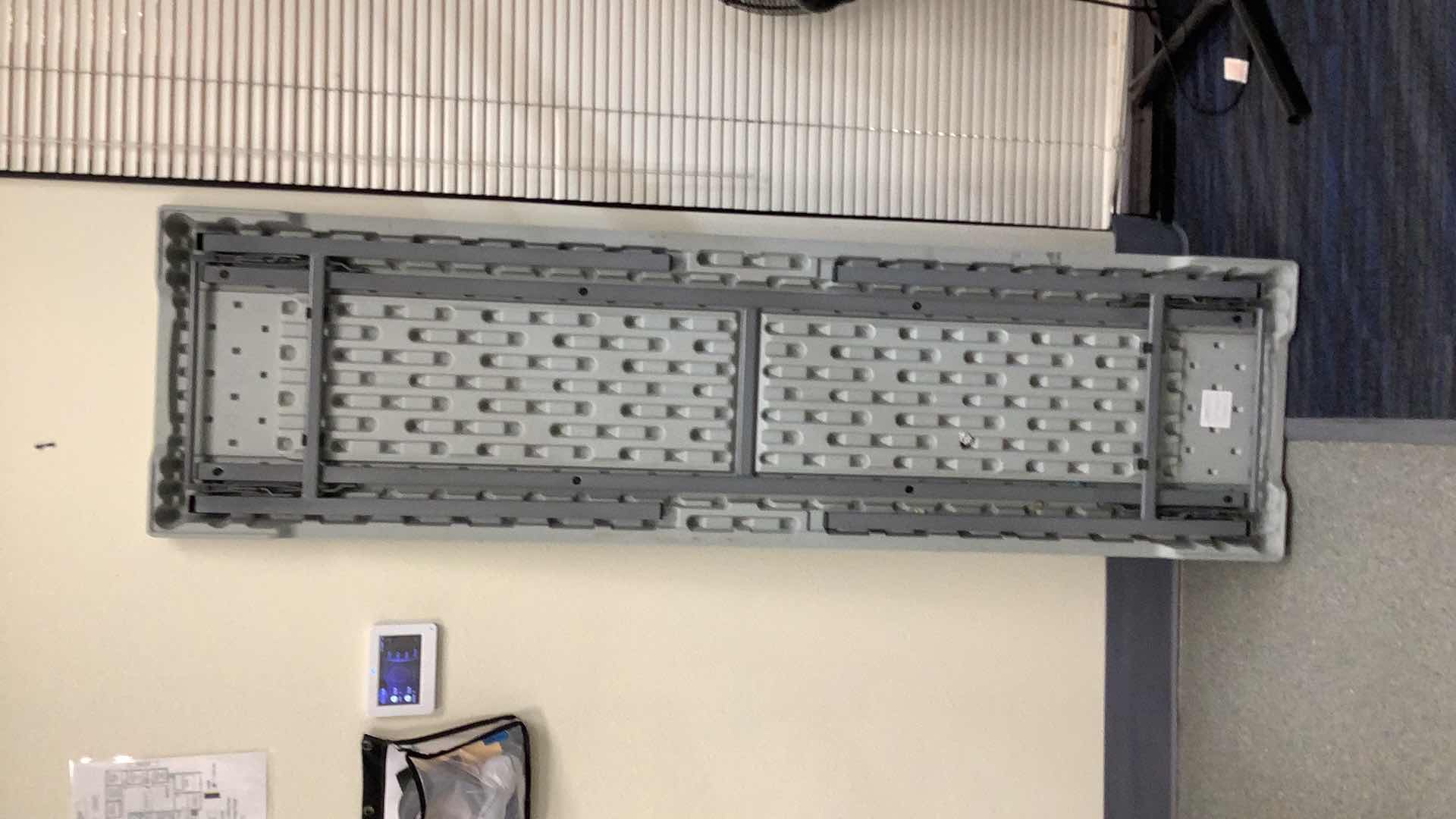 Photo 1 of MULTIPURPOSE FOLDING TABLE 71”X 20” H29” 