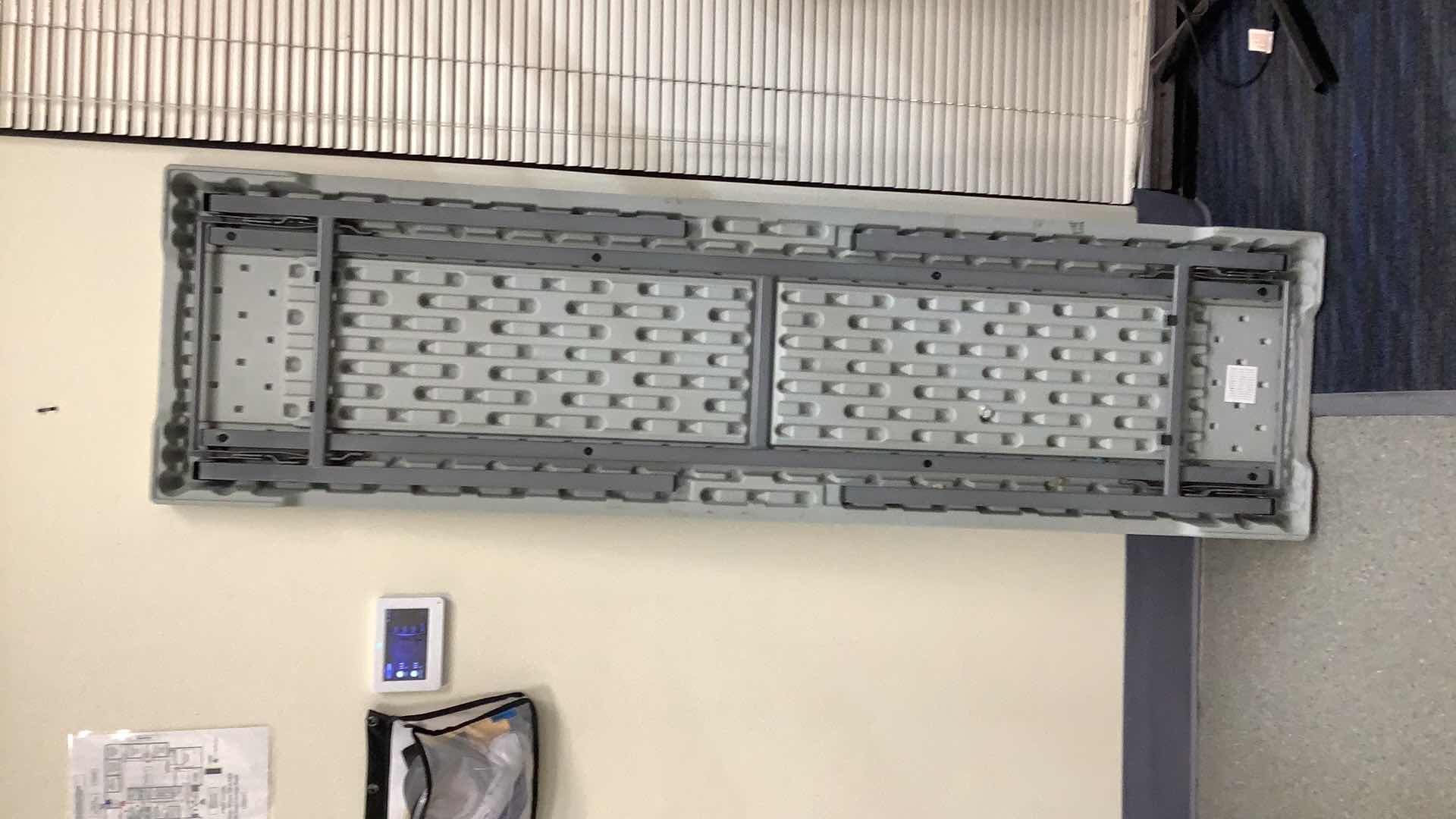 Photo 1 of MULTIPURPOSE FOLDING TABLE 71”X 20” H29” 