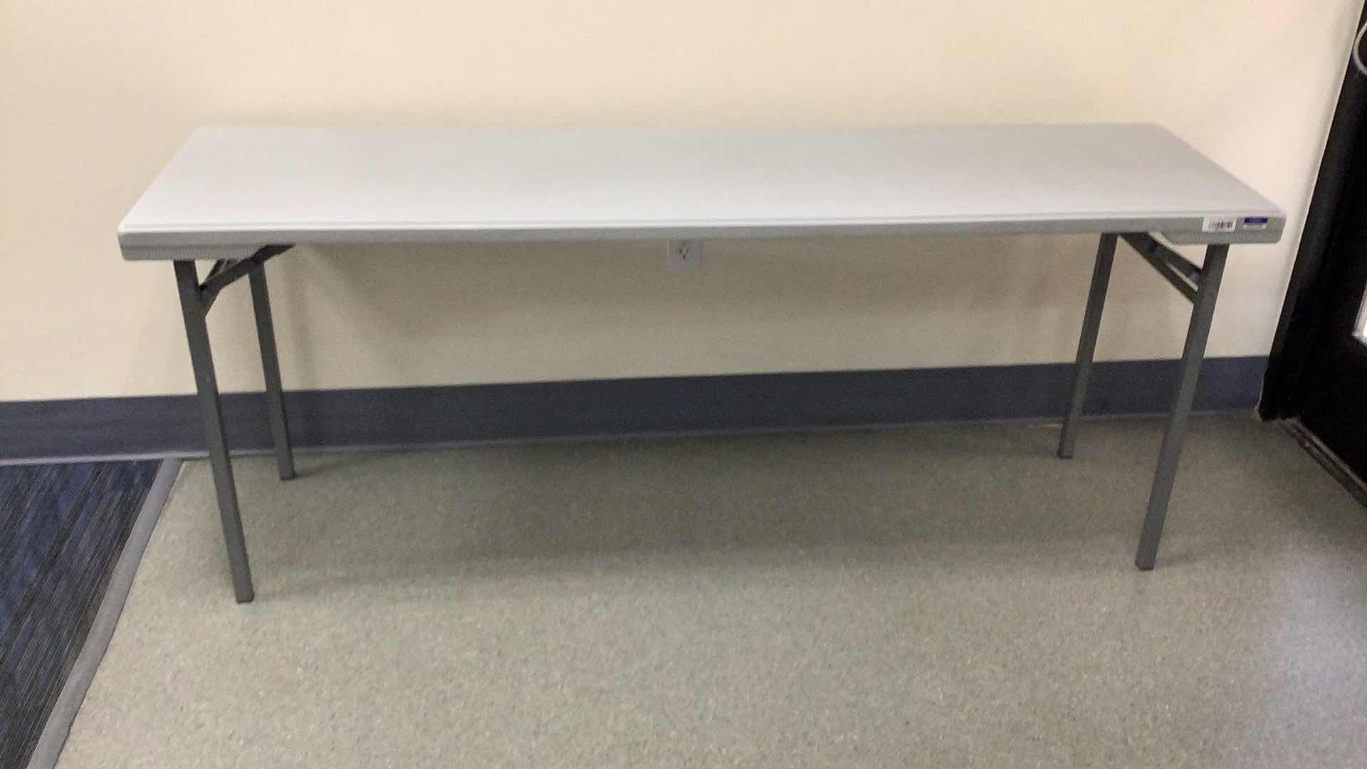 Photo 1 of MULTIPURPOSE FOLDING TABLE 71”X 20” H29” 