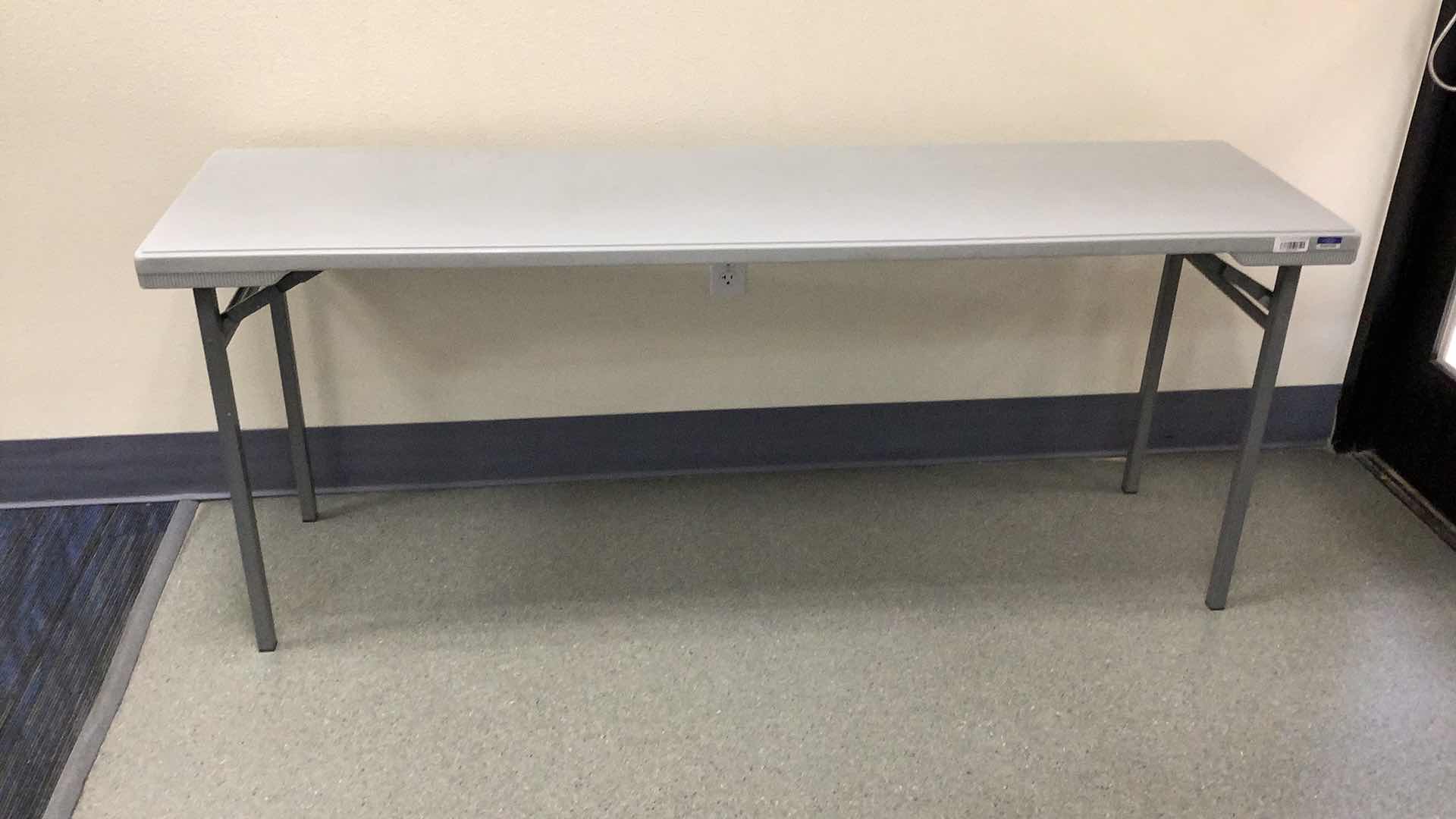Photo 1 of MULTIPURPOSE FOLDING TABLE 71”X 20” H29” 