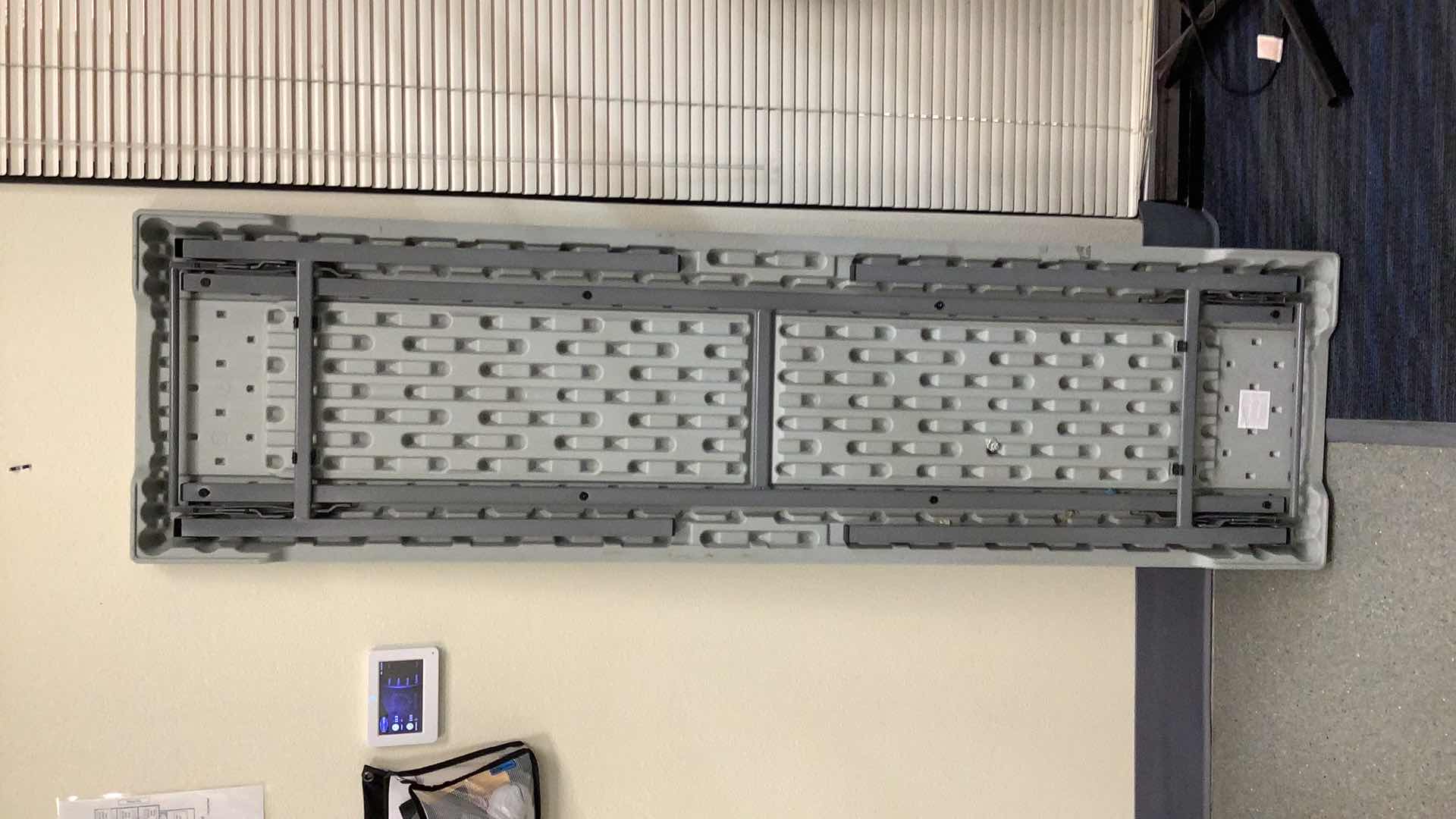 Photo 1 of MULTIPURPOSE FOLDING TABLE 71”X 20” H29” 