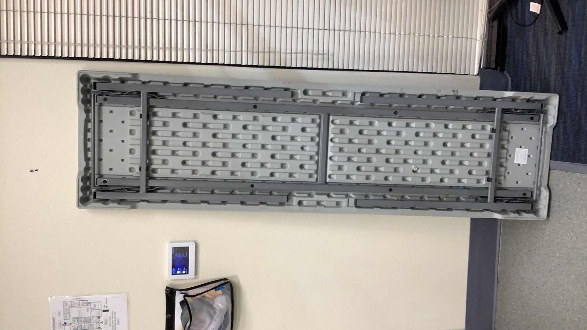 Photo 1 of MULTIPURPOSE FOLDING TABLE 71”X 20” H29” 