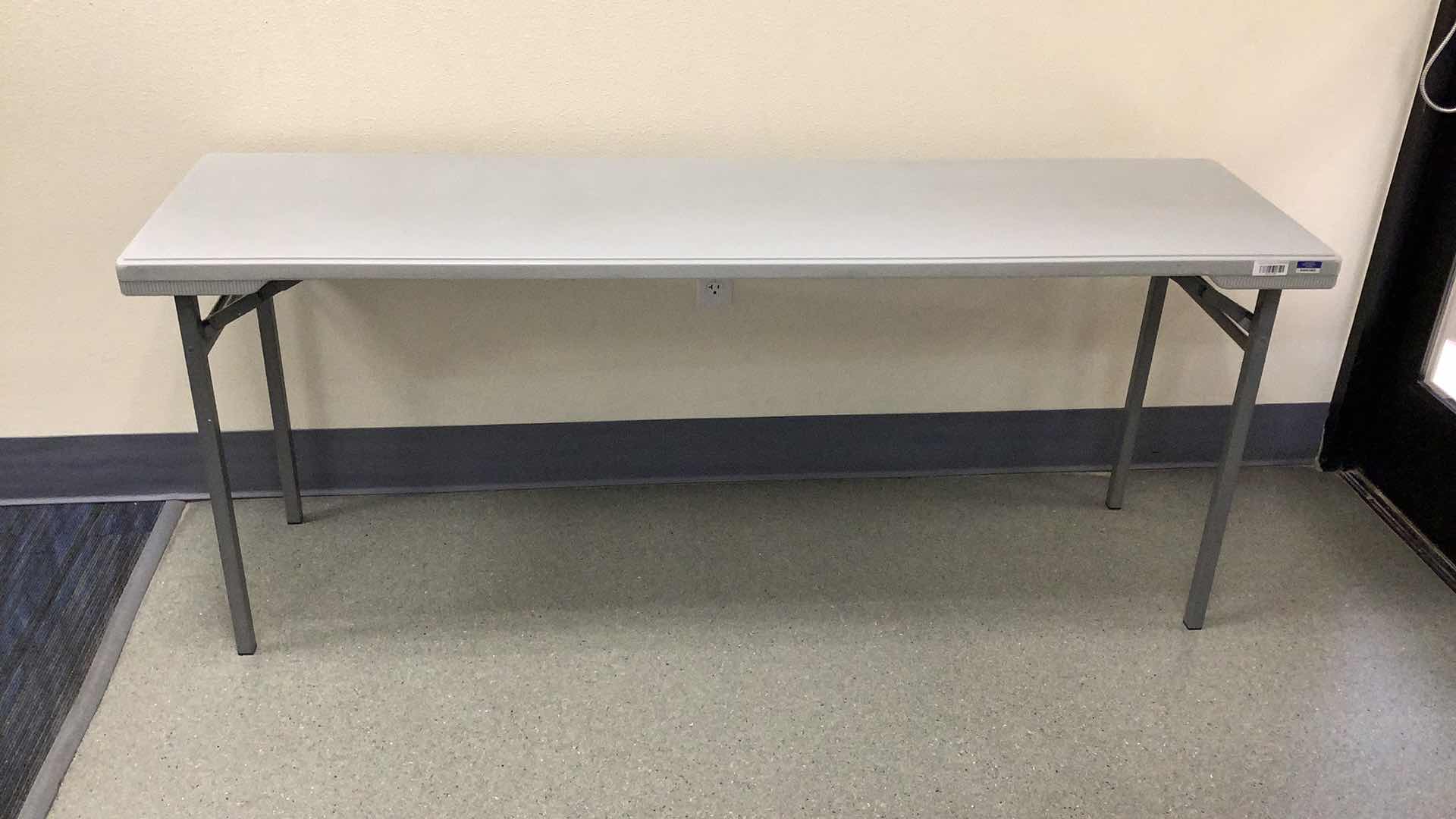 Photo 1 of MULTIPURPOSE FOLDING TABLE 71”X 20” H29” 