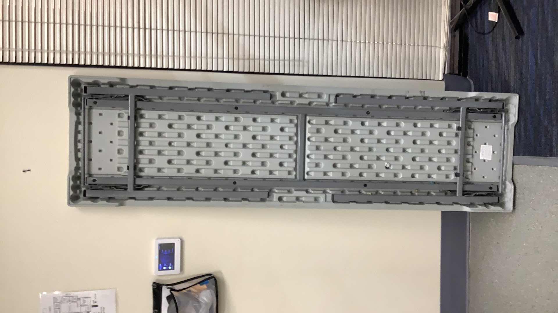 Photo 1 of MULTIPURPOSE FOLDING TABLE 71”X 20” H29” 