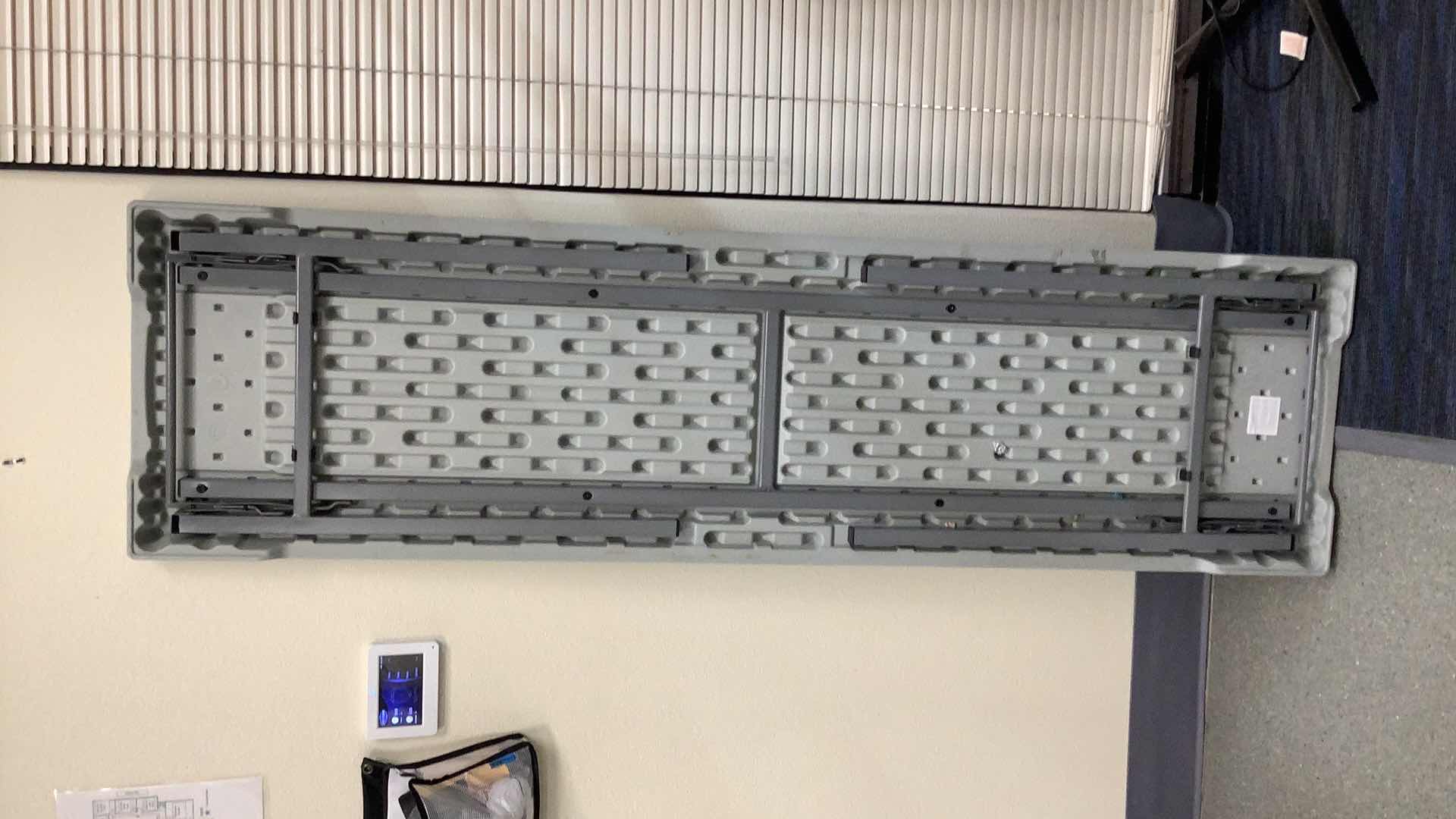 Photo 1 of MULTIPURPOSE FOLDING TABLE 71”X 20” H29” 