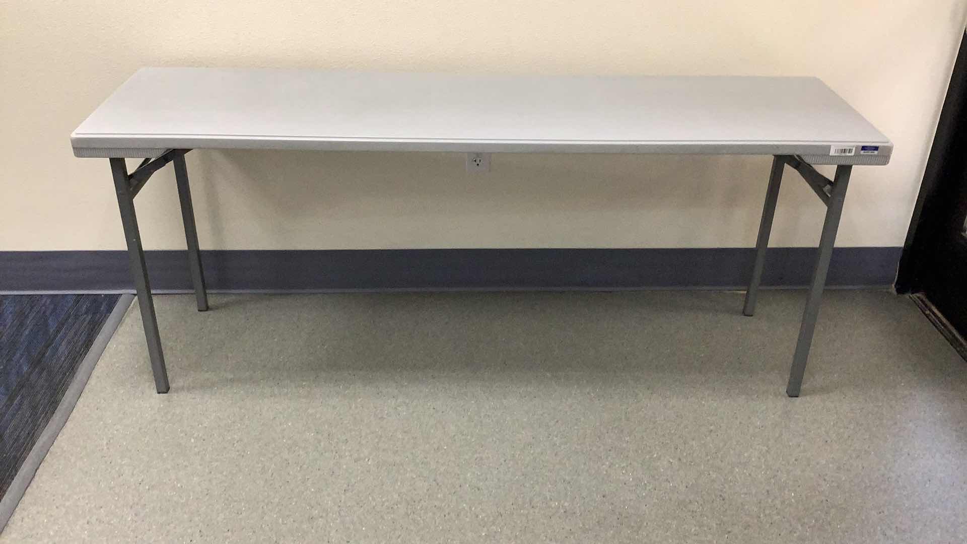 Photo 1 of MULTIPURPOSE FOLDING TABLE 71”X 20” H29” 