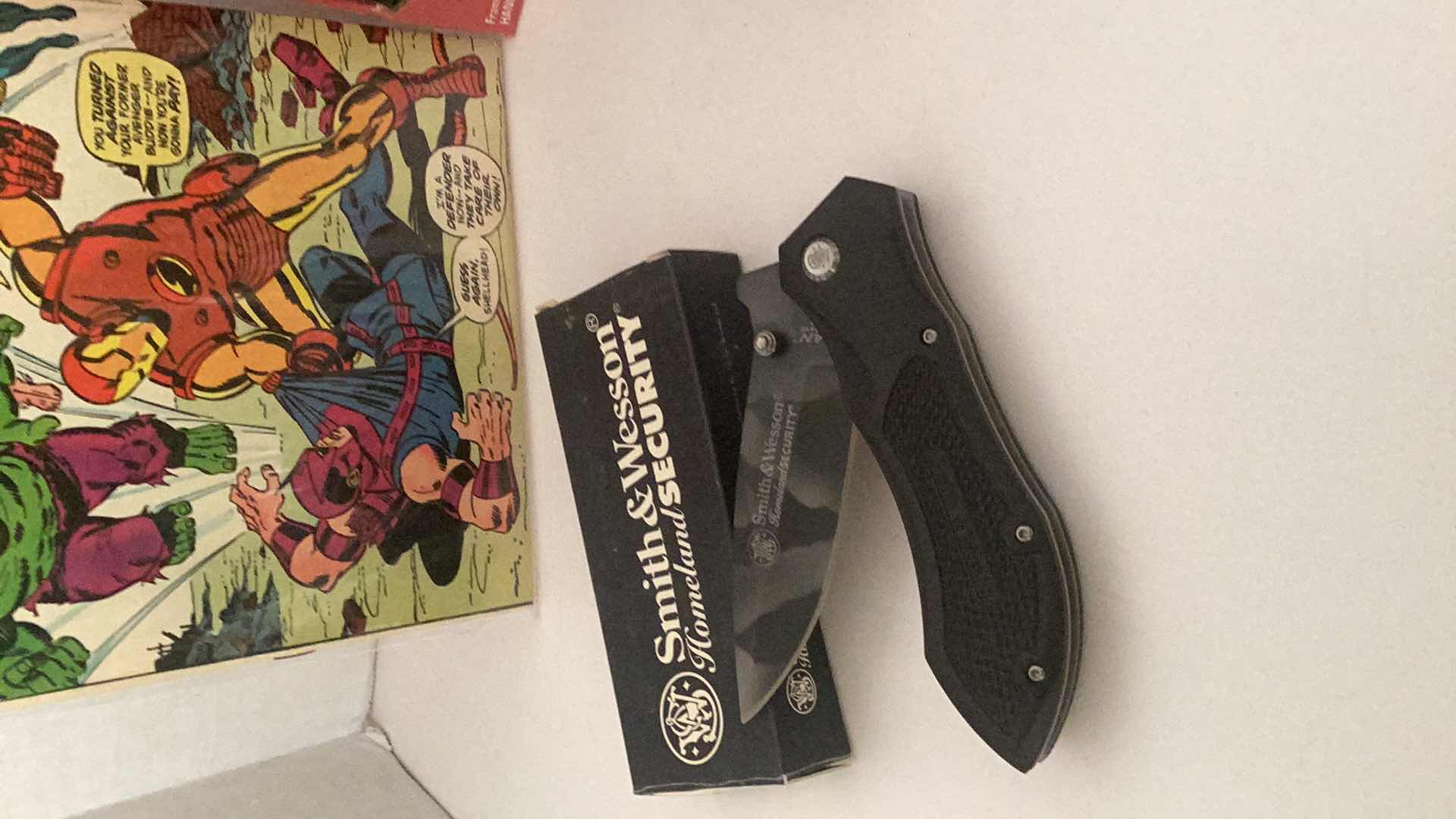 Photo 3 of ASSORTED COLLECTIBLE'S-COMIC BOOK, KNIFE, RINGS, NASCAR & OAKLAND RAIDER'S CLOCK