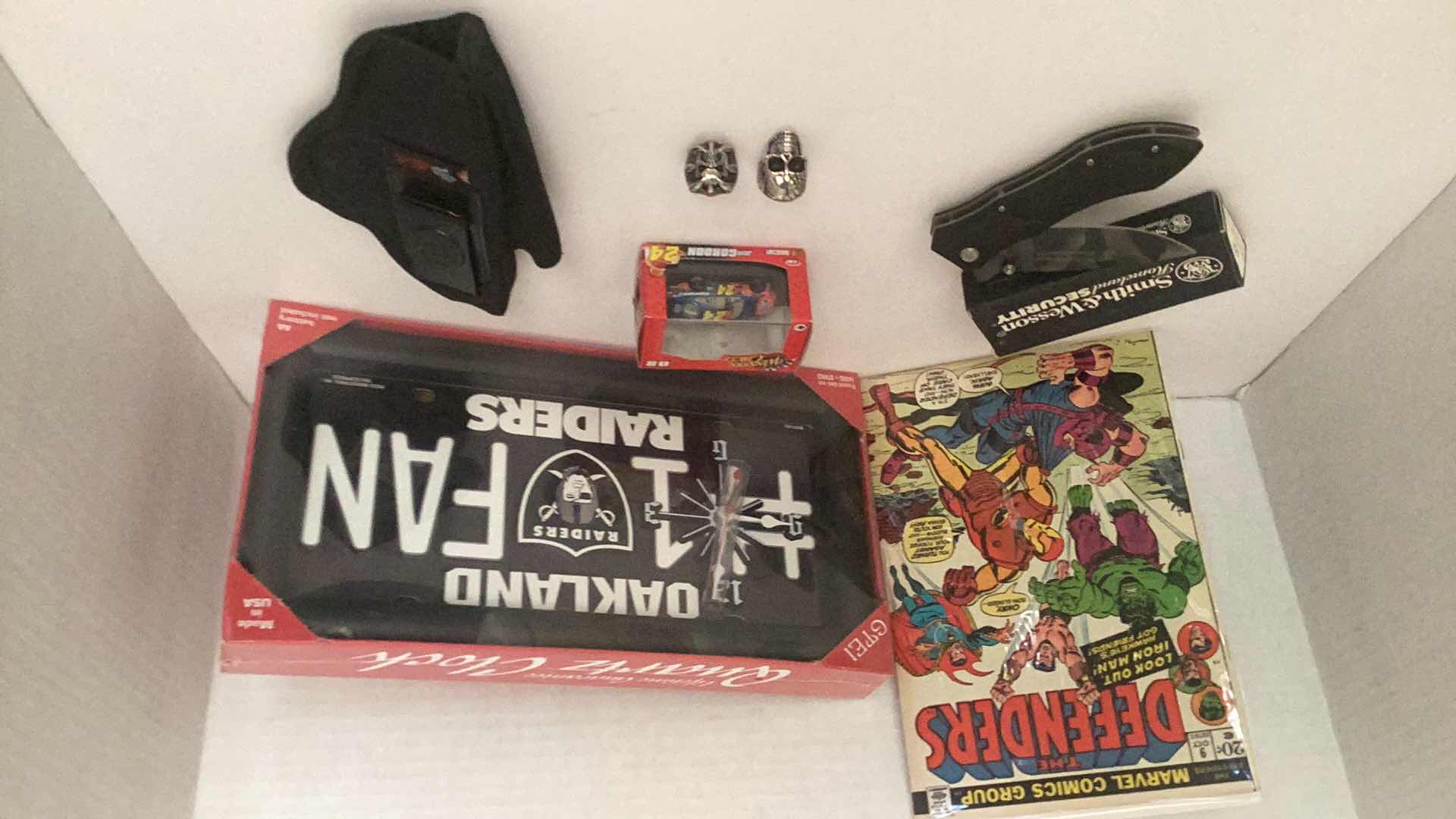 Photo 1 of ASSORTED COLLECTIBLE'S-COMIC BOOK, KNIFE, RINGS, NASCAR & OAKLAND RAIDER'S CLOCK