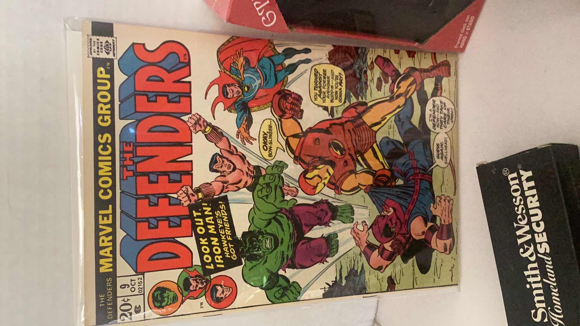 Photo 1 of ASSORTED COLLECTIBLE'S-COMIC BOOK, KNIFE, RINGS, NASCAR & OAKLAND RAIDER'S CLOCK