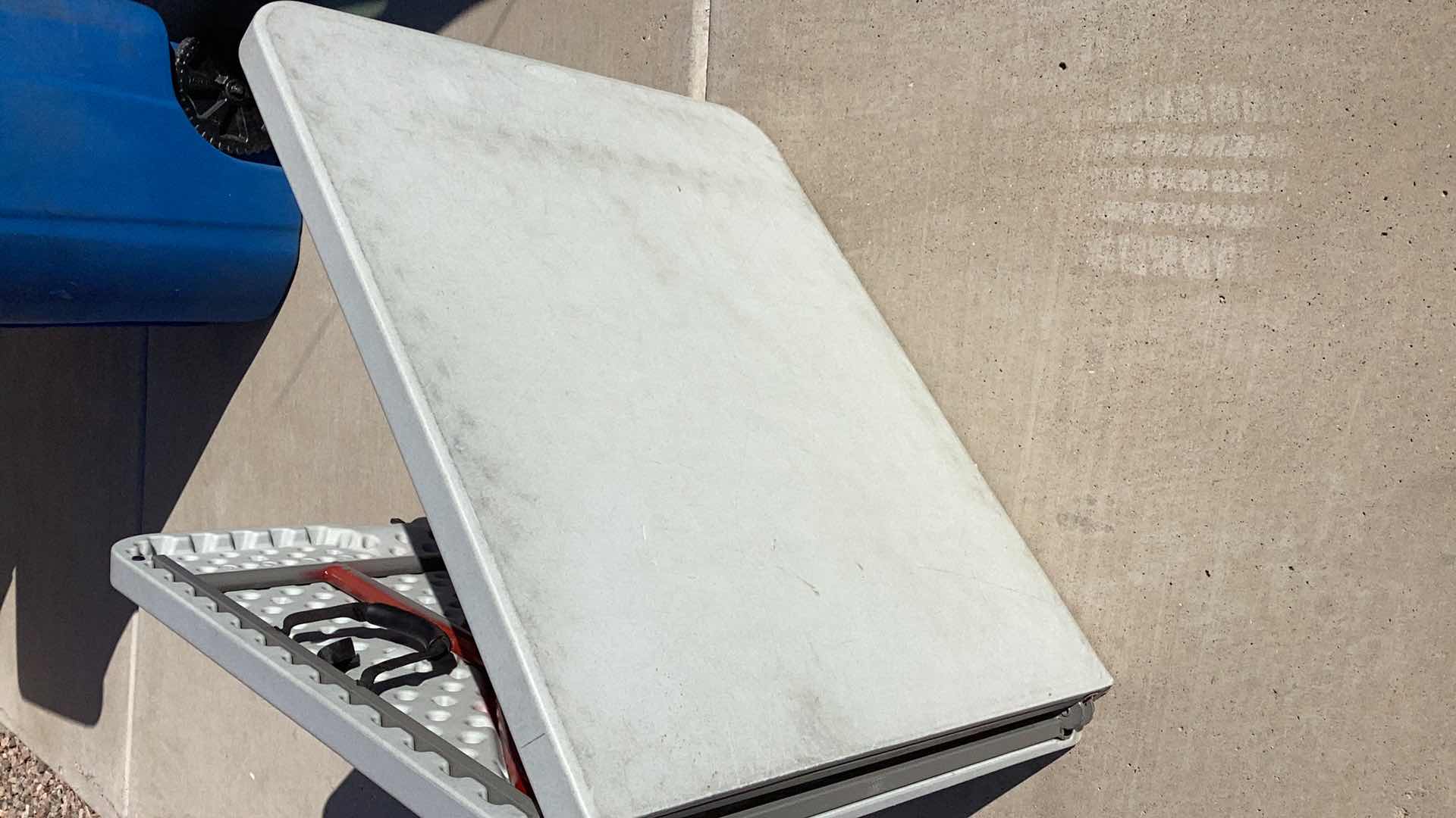 Photo 2 of 70” X 30” HEAVY DUTY 300 POUND LIMIT FOLDABLE TABLE