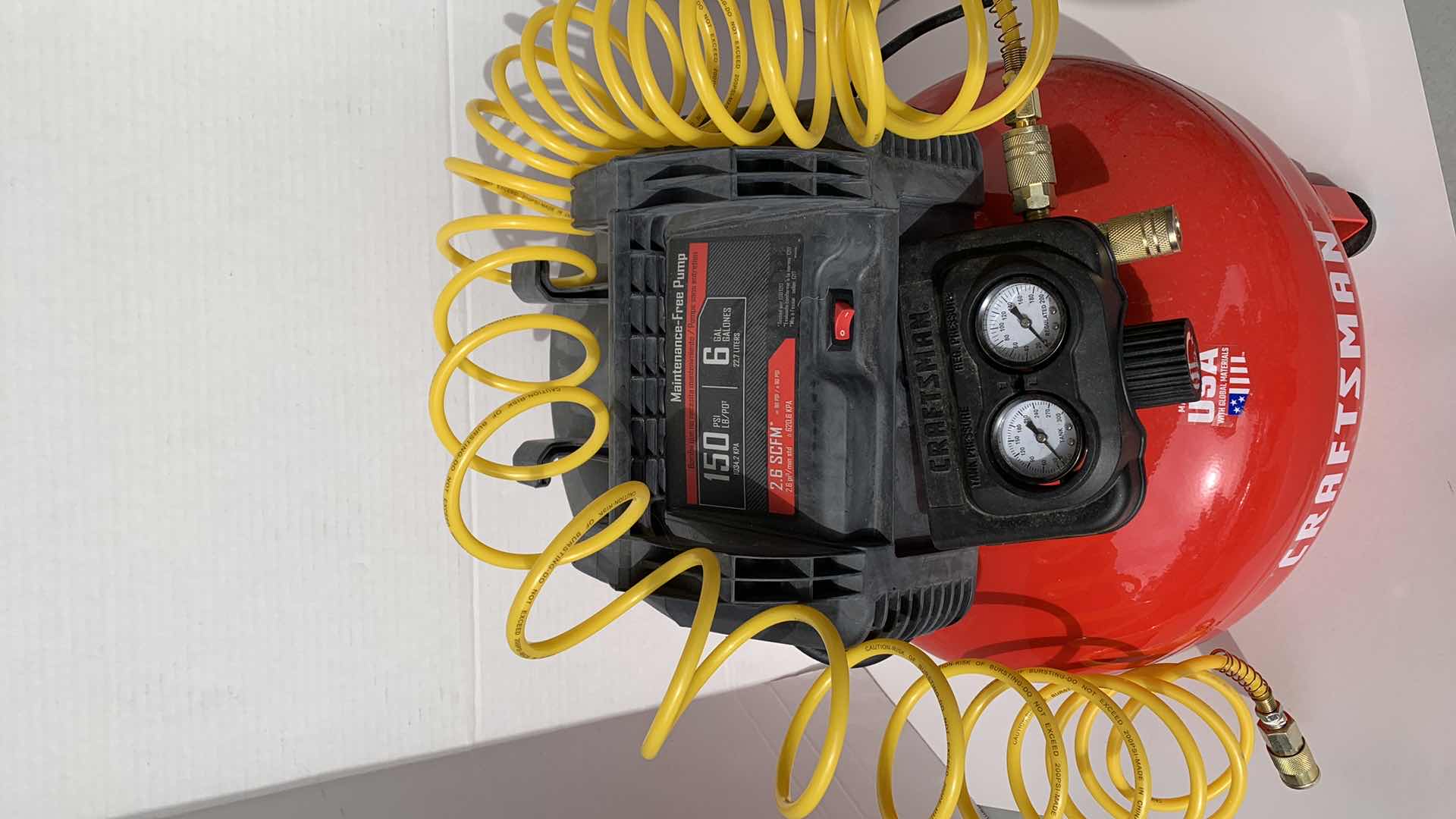 Photo 1 of CRAFTSMAN 150 PSI 6 GALLON MAINTENANCE FREE AIR PUMP AND TIRE INFLATION TIP.