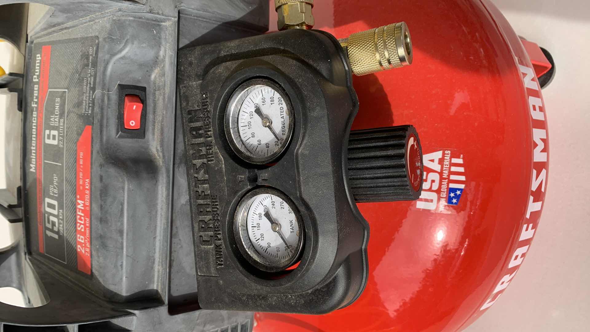 Photo 1 of CRAFTSMAN 150 PSI 6 GALLON MAINTENANCE FREE AIR PUMP AND TIRE INFLATION TIP.