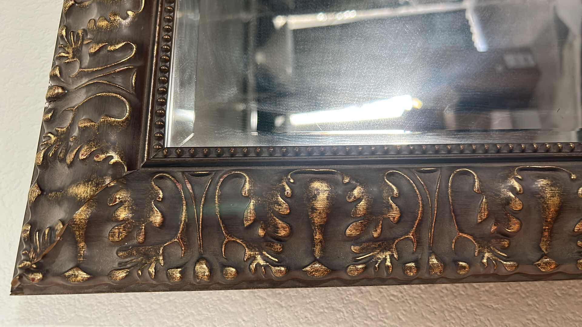 Photo 1 of ORNATELY FRAMED BEVELED GLASS MIRROR 
24” x 29 1/2