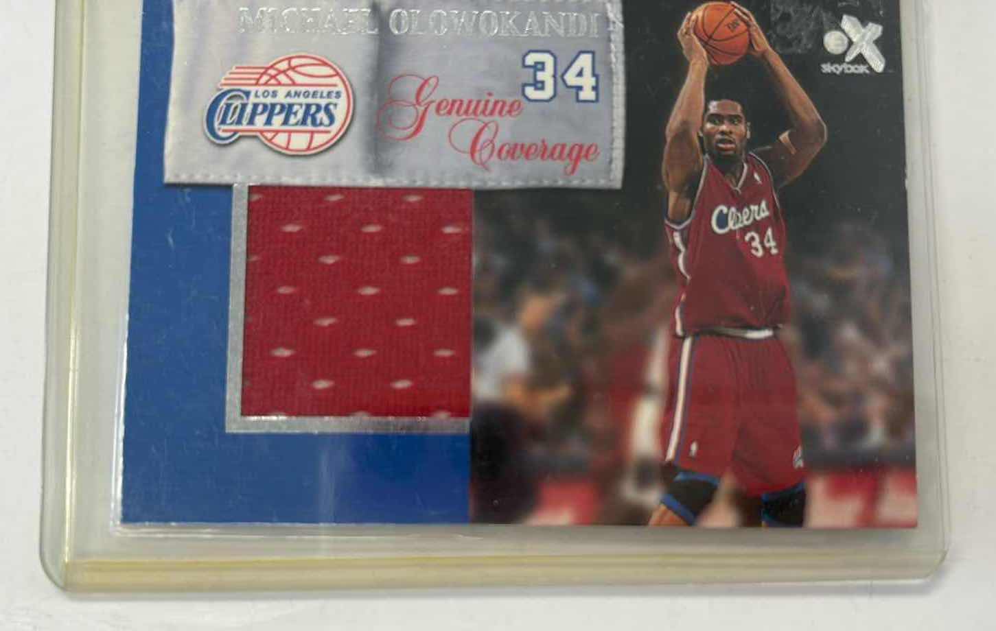 Photo 1 of 2000 MICHAEL OLOWOKANDI CLIPPERS SKYBOX GENUINE COVERAGE